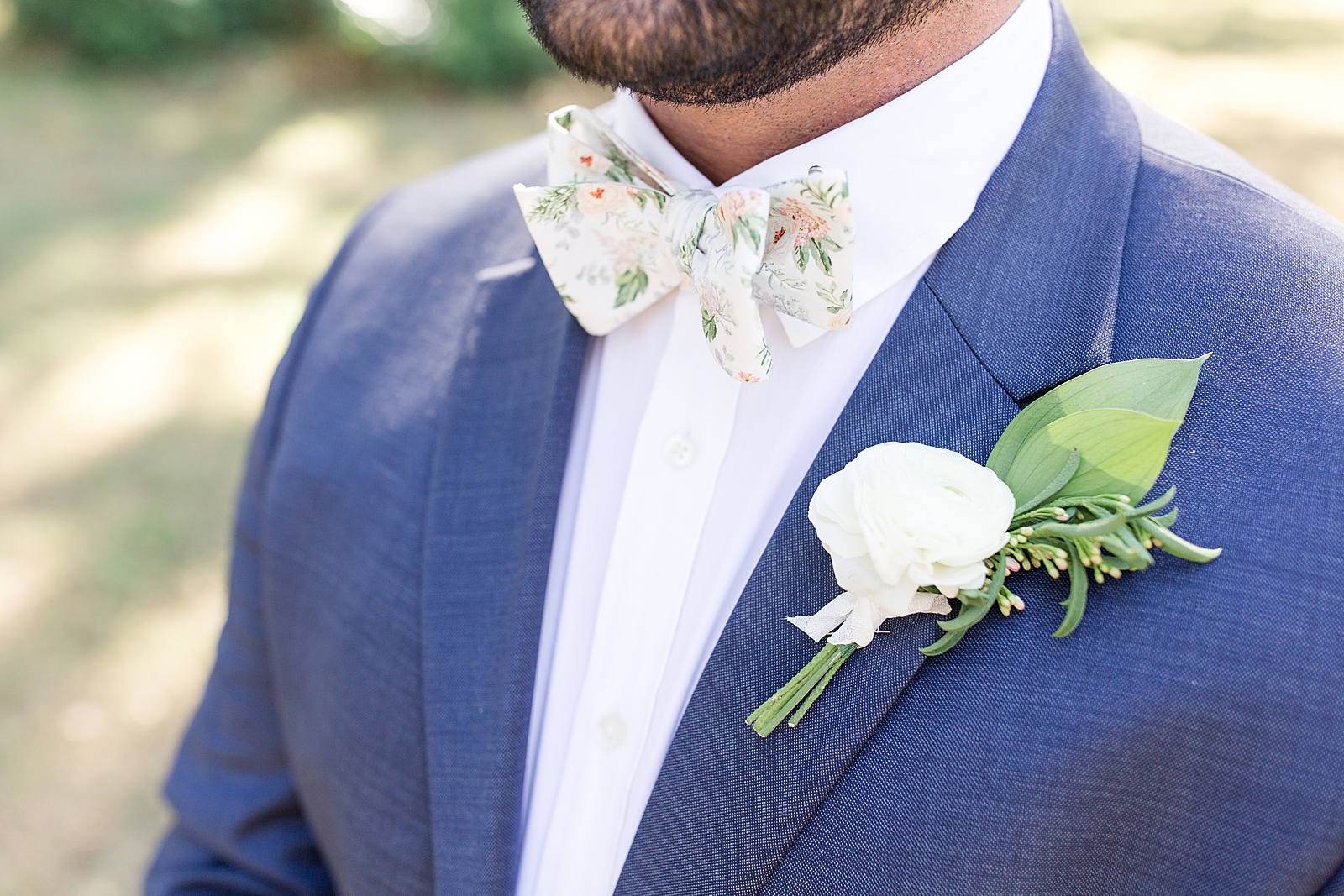 Enchanted Oaks Jacksonville Wedding Detail of floral bow tie and Boutonnière Photo