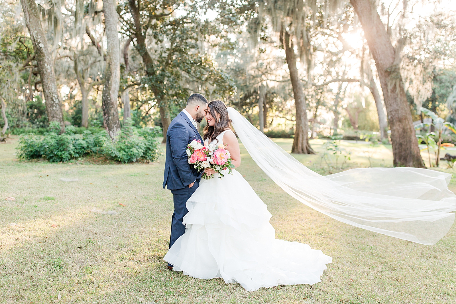 Enchanted Oaks Jacksonville Wedding Bride and Groom Nose to Nose with Veil Blowing in the Wind Photo