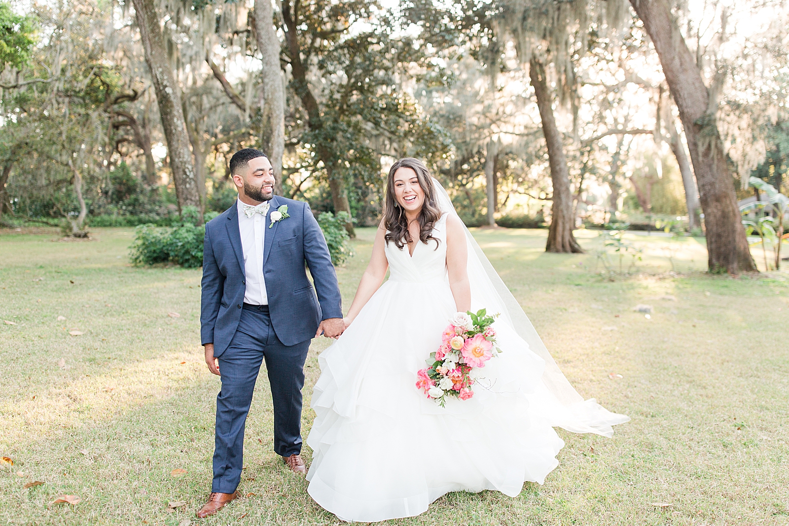 Enchanted Oaks Jacksonville Wedding Bride and Groom Smiling and Walking toward Camera Photo
