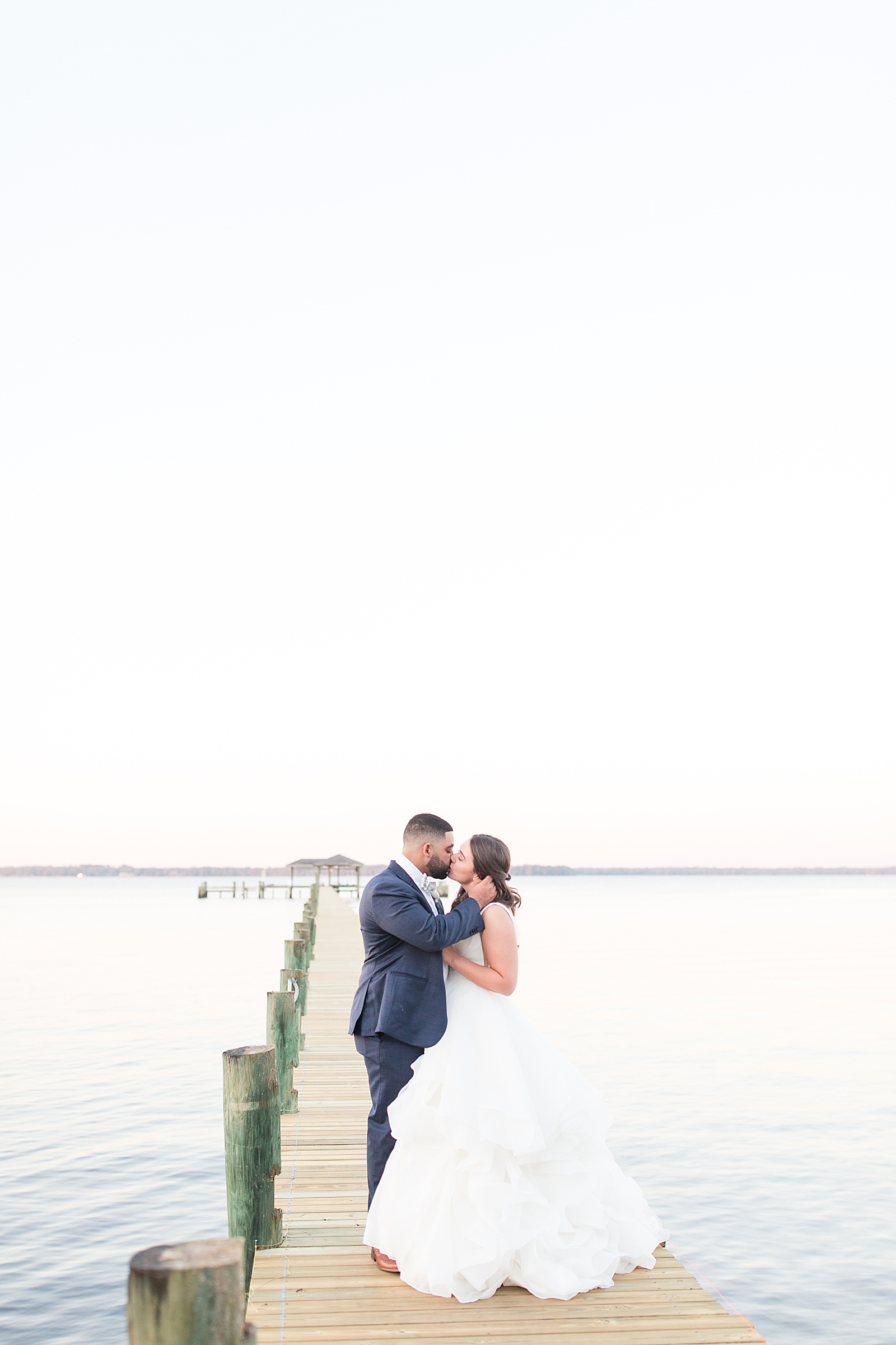 Enchanted Oaks Jacksonville Wedding Bride and Groom Kissing on Dock Photo