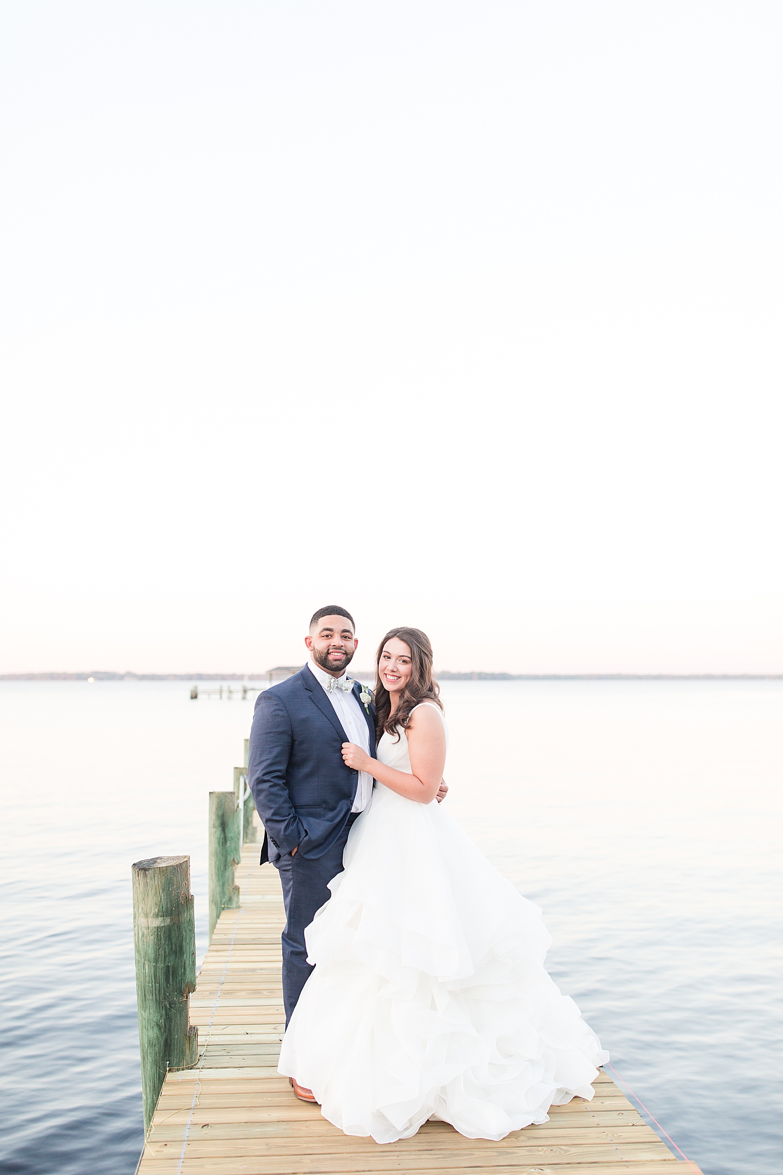 Enchanted Oaks Jacksonville Wedding Bride and Groom Smiling at Camera on Dock Photo