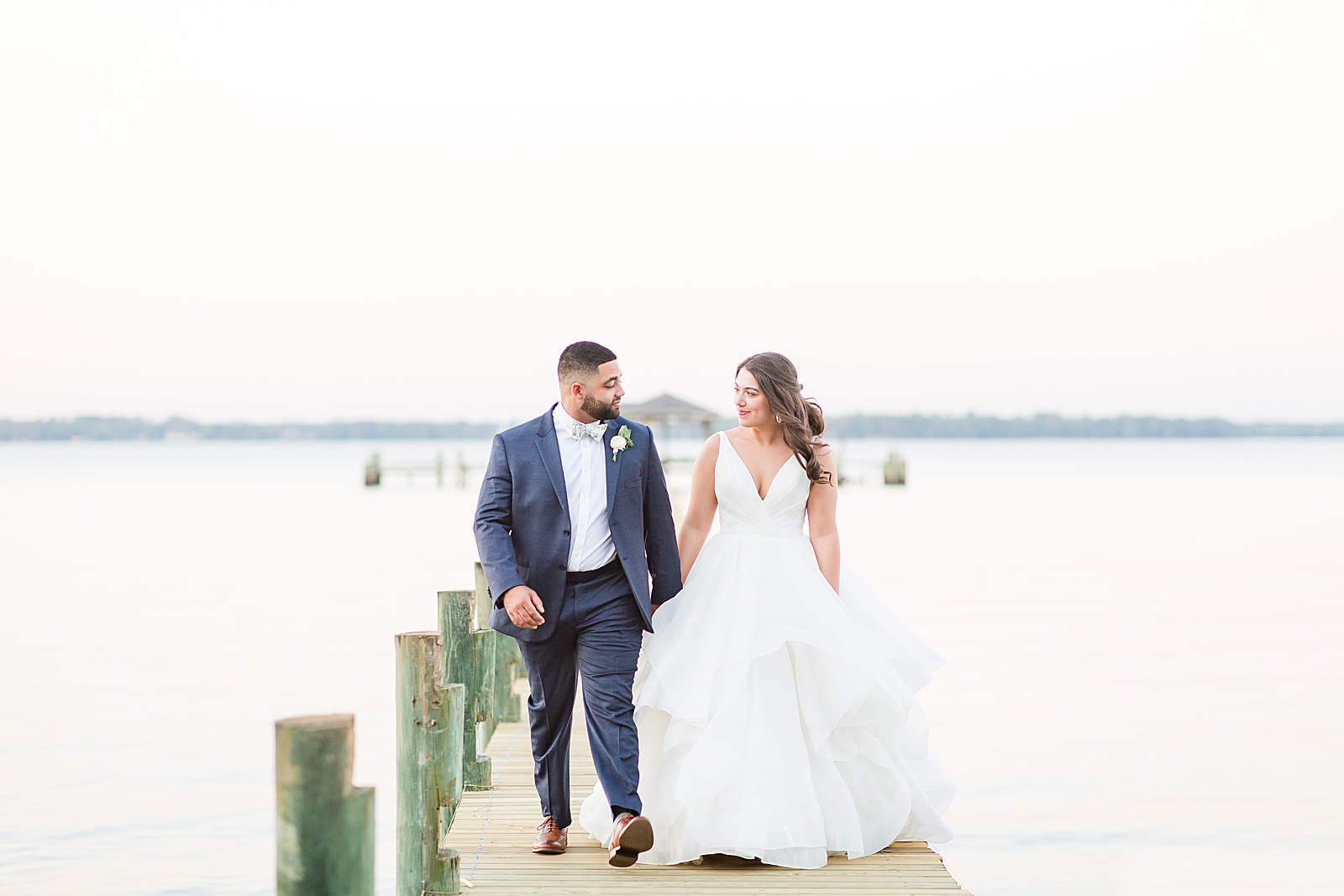 Enchanted Oaks Jacksonville Wedding Bride and Groom Walking on Dock Photo