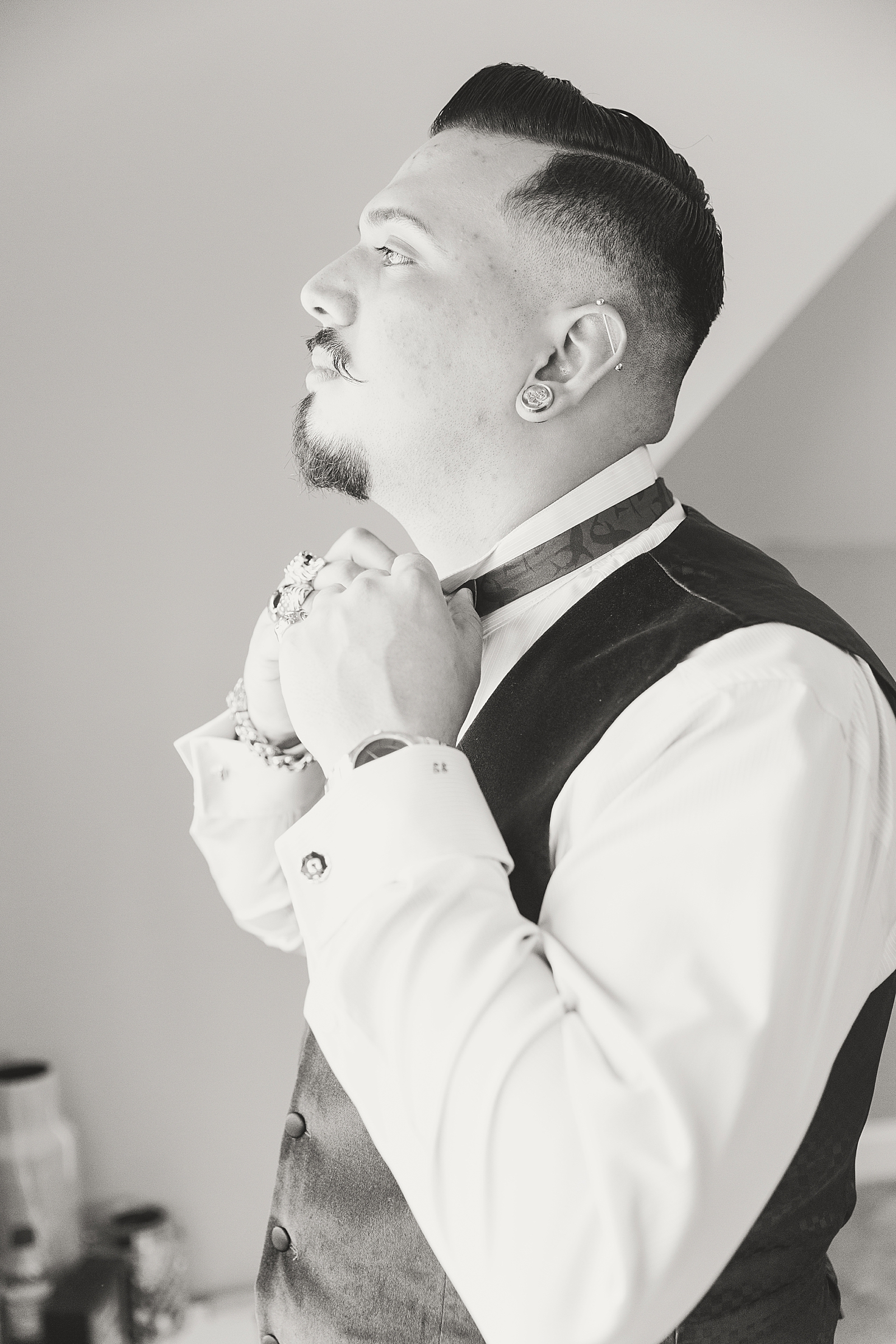 Mooresville Wedding Black and White of Groom tying bow tie Photo