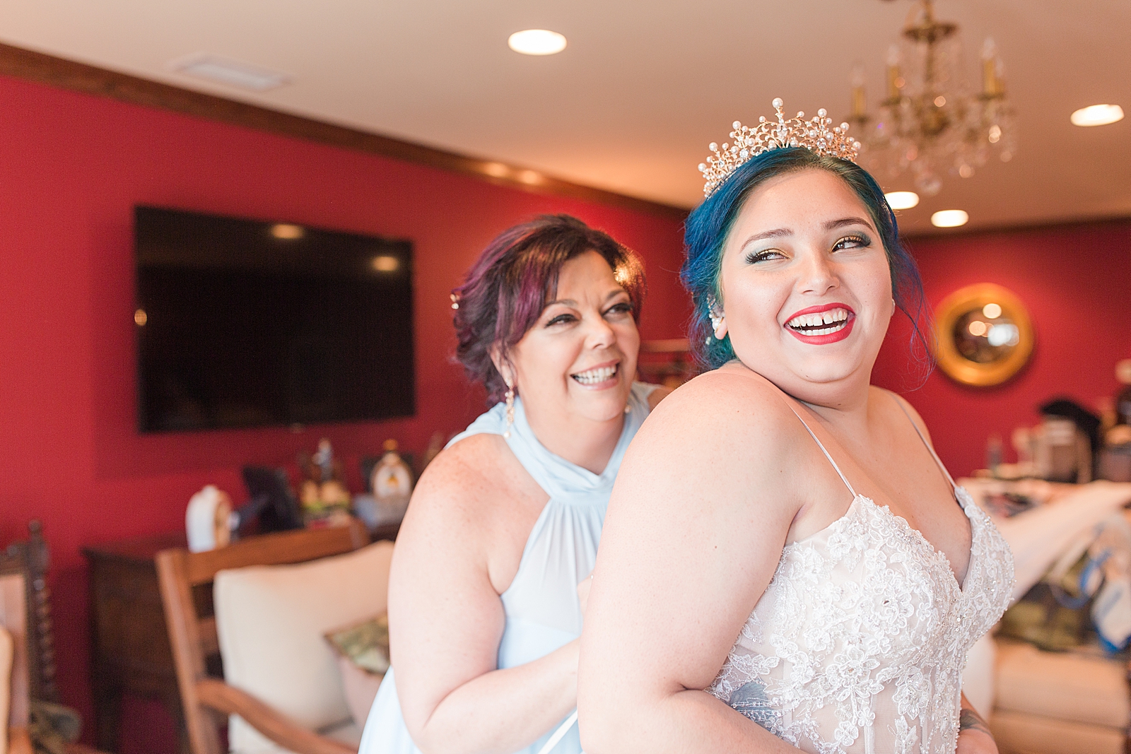 Mooresville Wedding Bride and Mother Laughing while mom helps with dress Photo