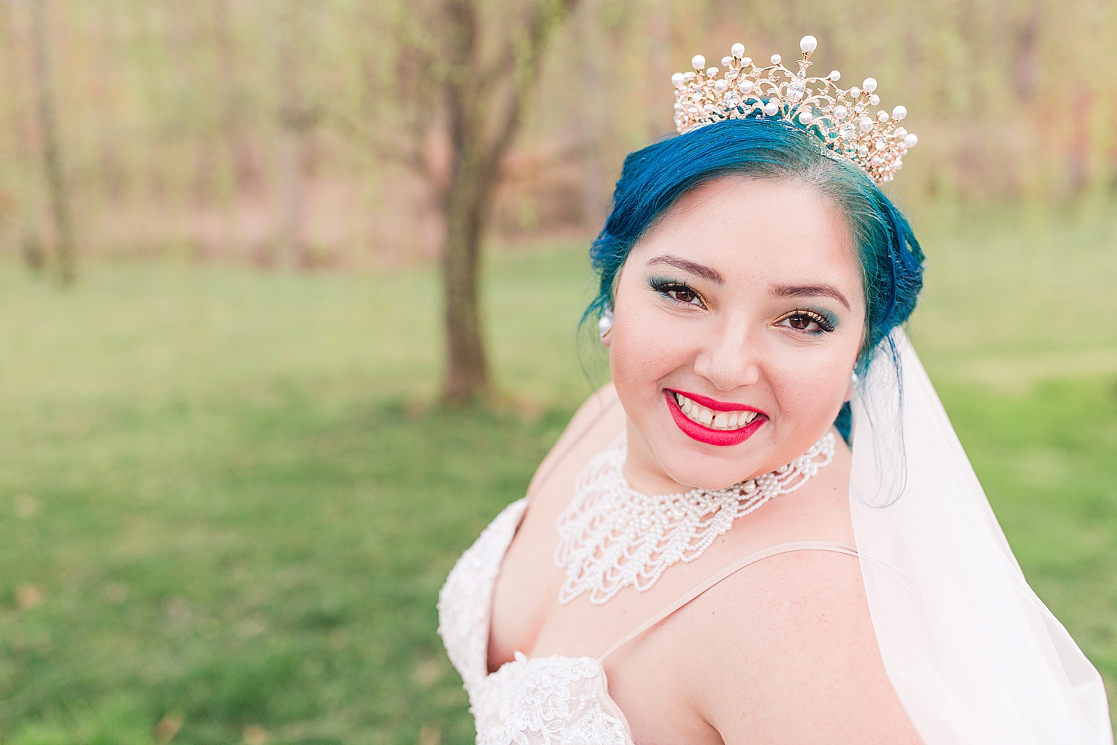 Mooresville Wedding blue haired bride with bright red lipstick smiling at camera Photo