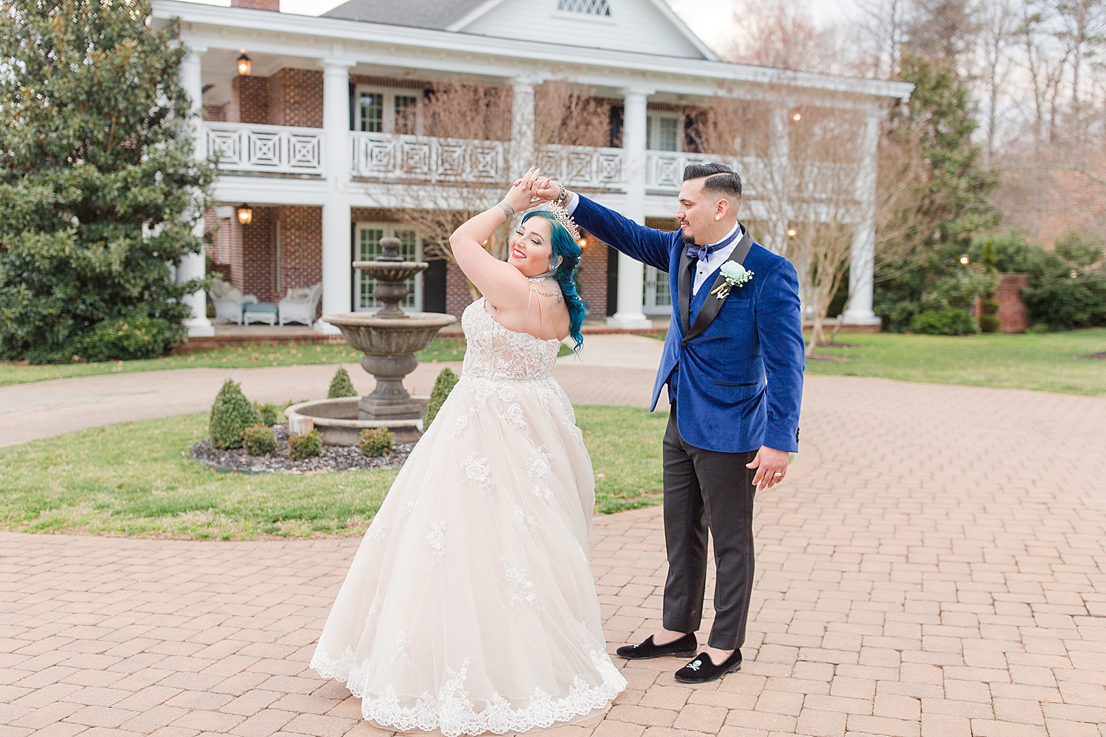Mooresville Wedding Groom twirling bride in driveway Photo