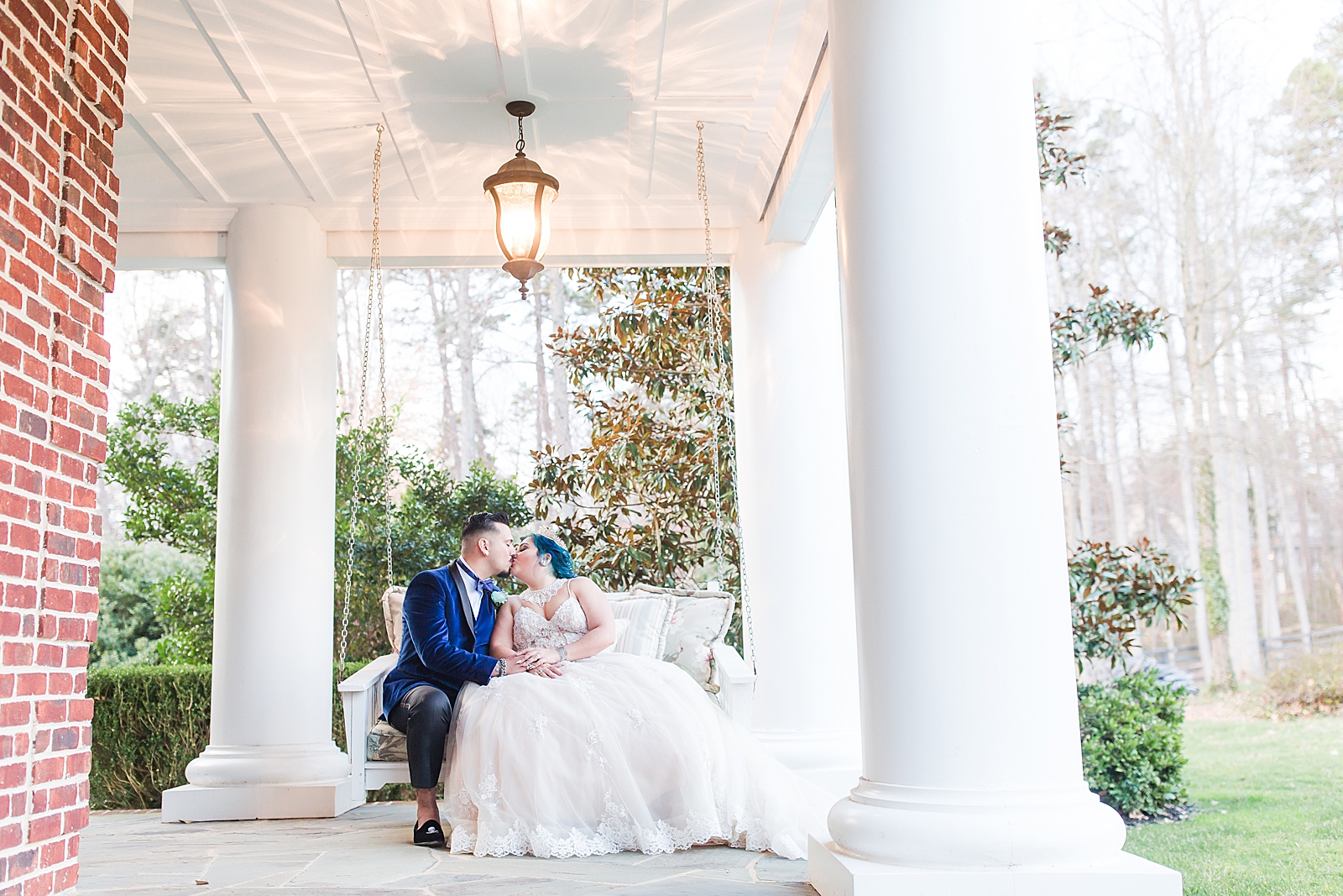 Mooresville Wedding Bride and Groom sitting on porch of Johnson Carriage House Photo