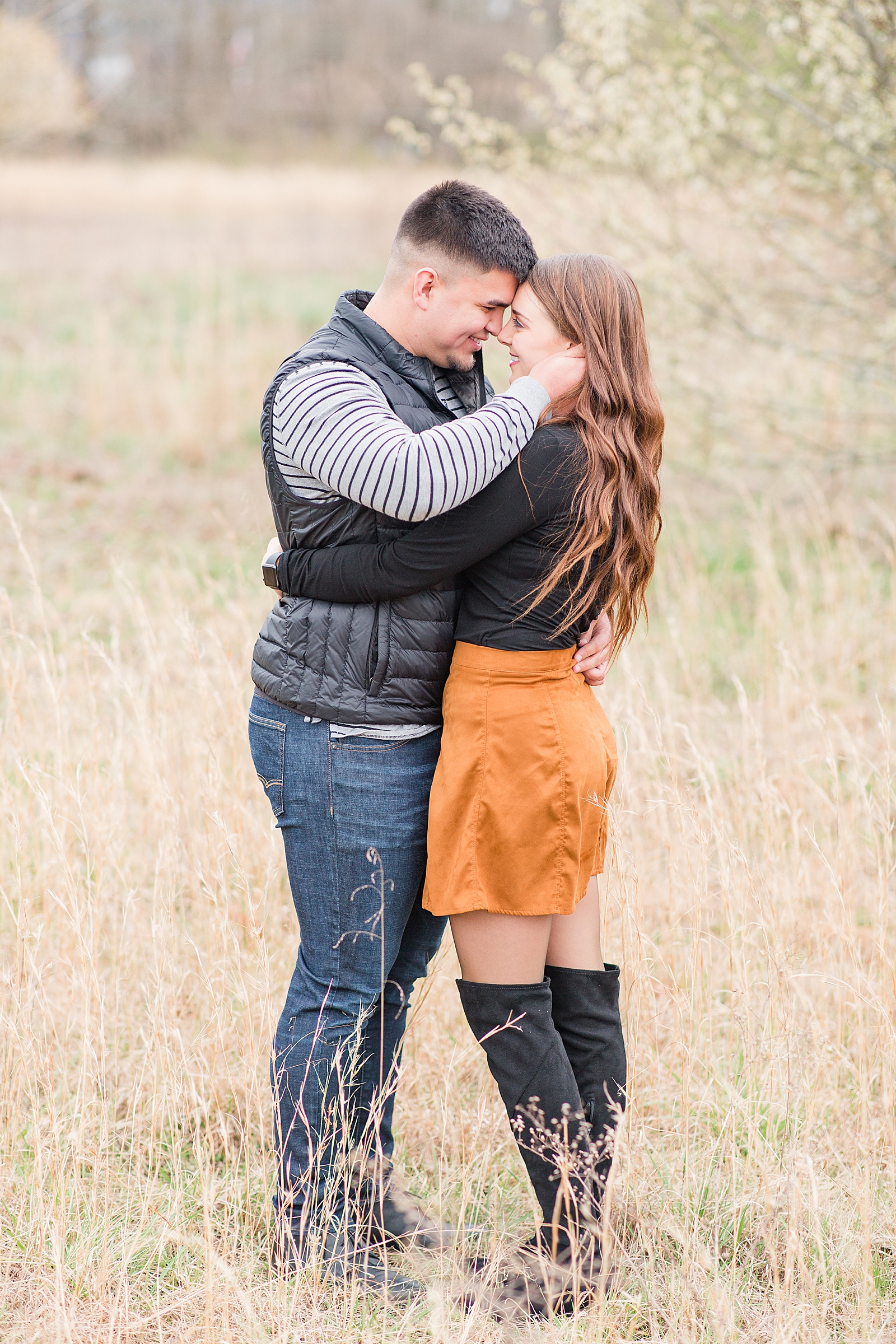 Andrews NC Spring Session Couple nose to nose in field of tall grass Photo