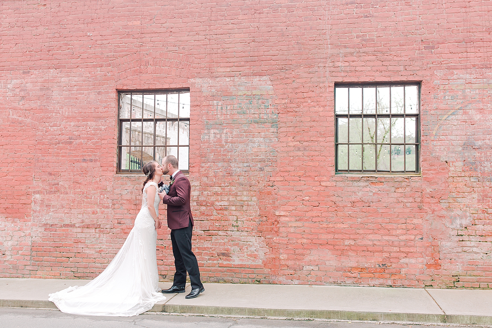 Hackney Warehouse Wedding Bride and Groom Kissing during first look Photo