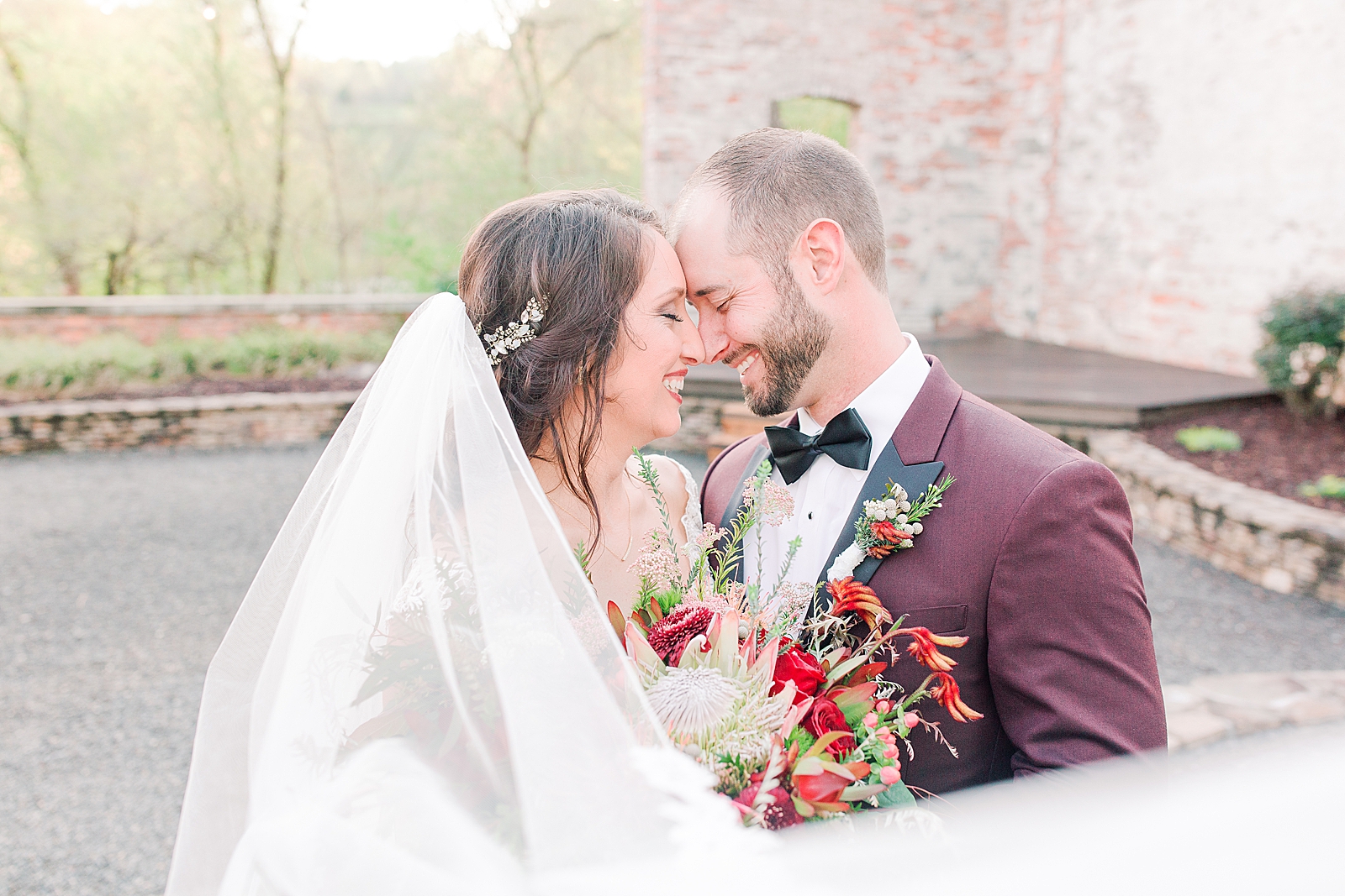 Hackney Warehouse Wedding Bride and Groom laughing nose to nose Photo