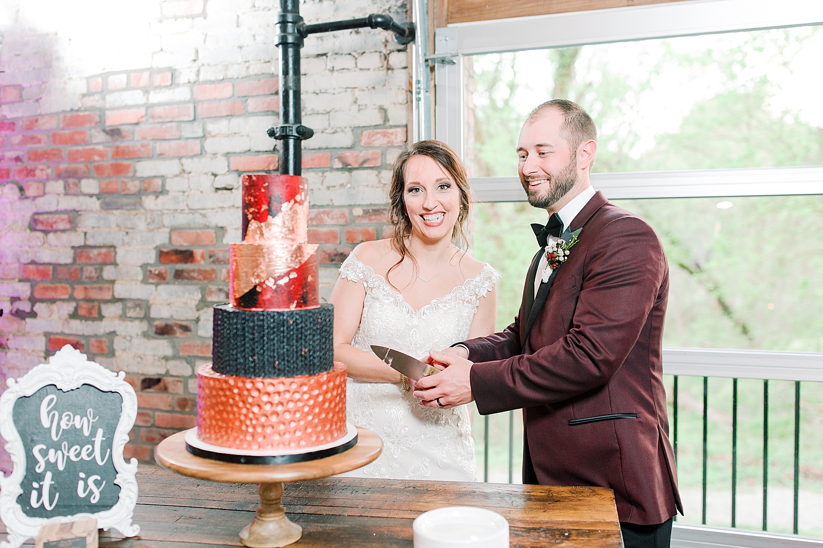 Hackney Warehouse Wedding Reception Bride and Groom cutting cake Photo