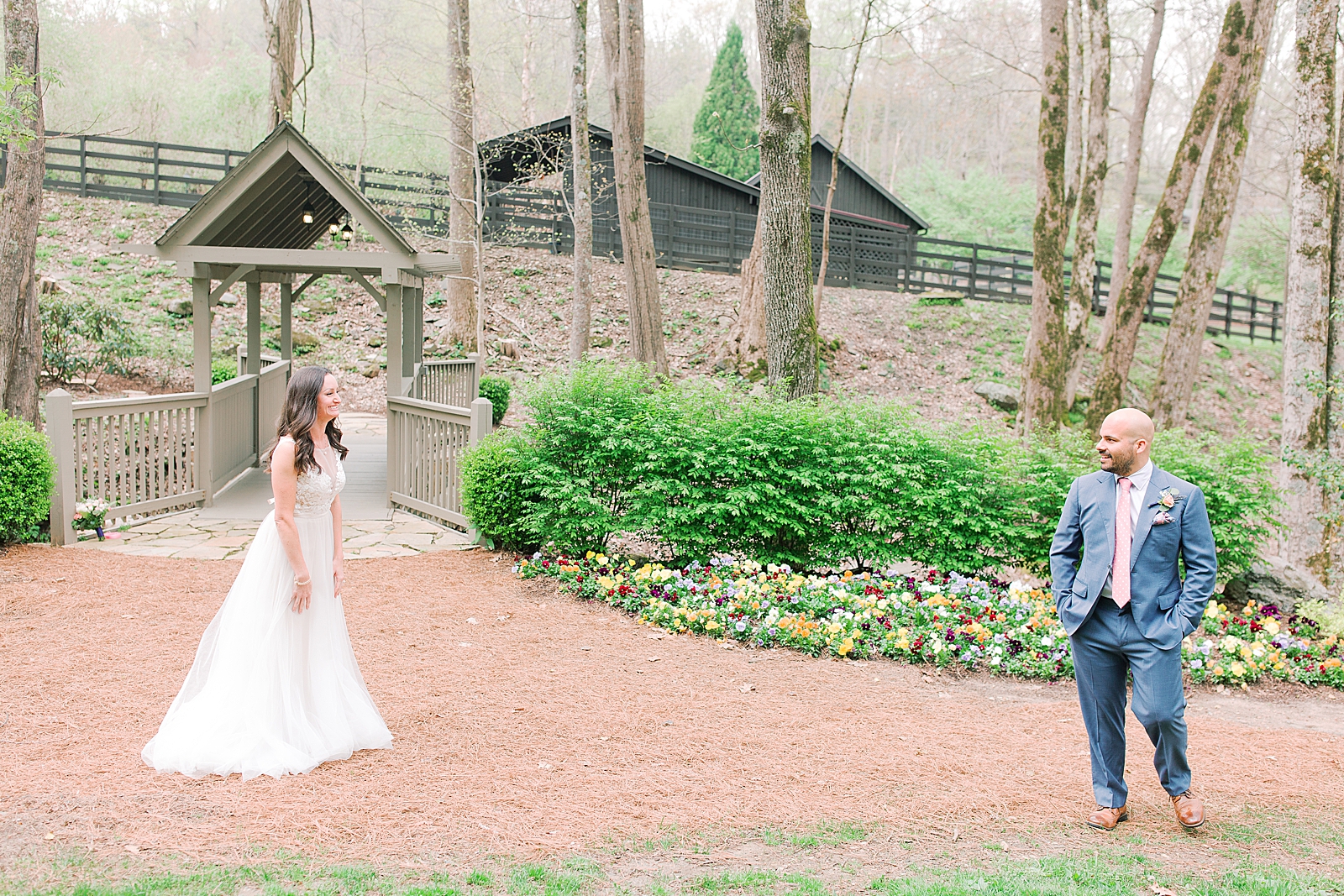 Spring Hawkesdene Wedding Bride and Grooms first look at covered bridge Photo