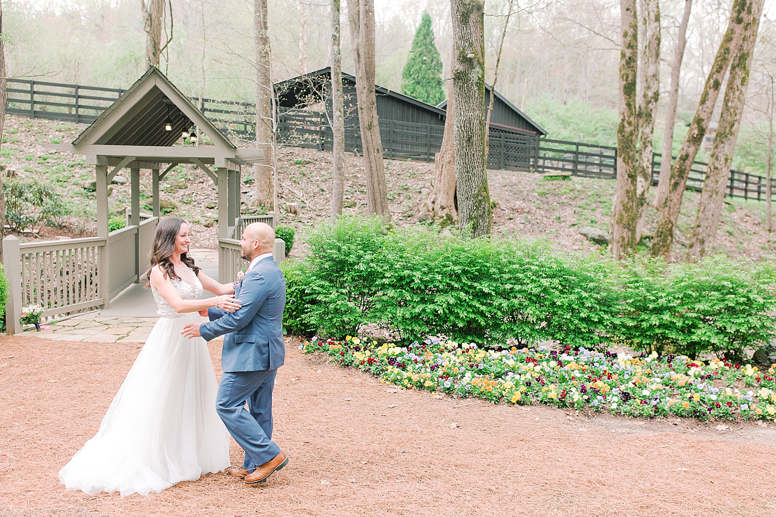 Spring Hawkesdene Wedding Bride and Grooms First look at covered bridge Photo