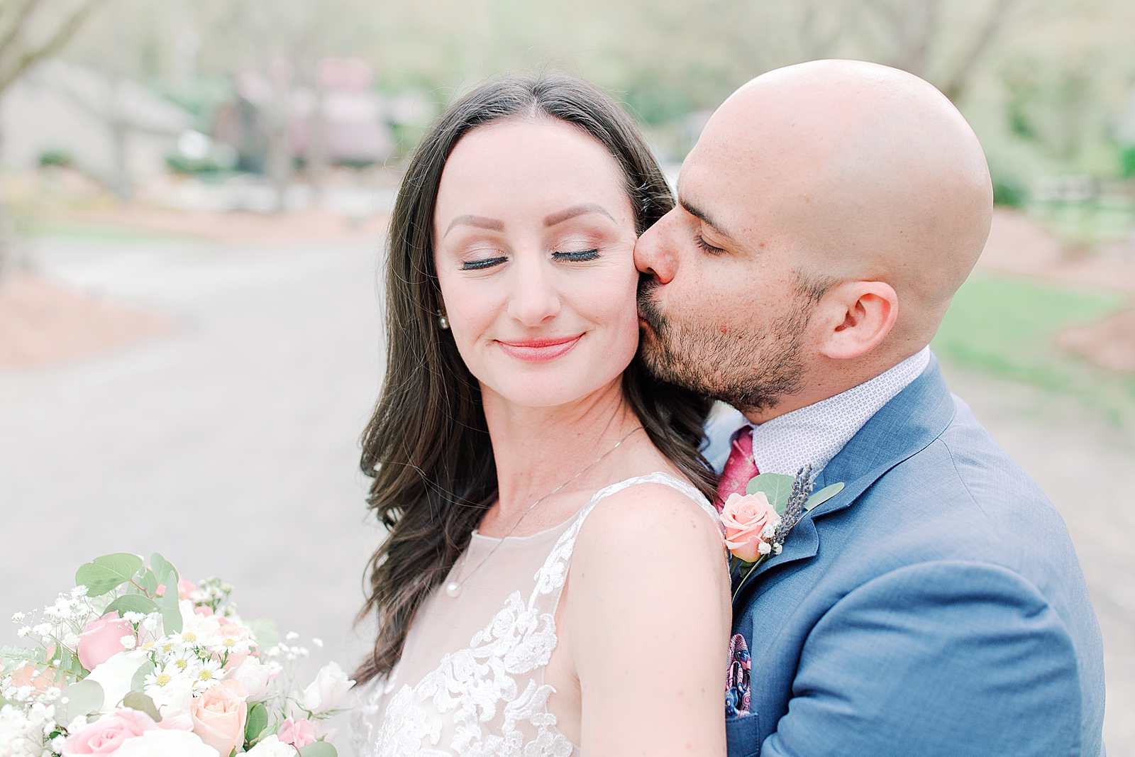 Spring Hawkesdene Wedding Groom kissing bride on cheek Photo