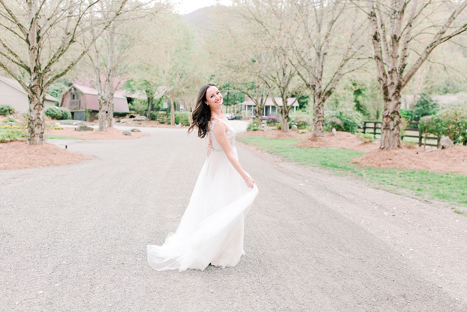 Spring Hawkesdene Wedding Bride twirling in driveway Photo