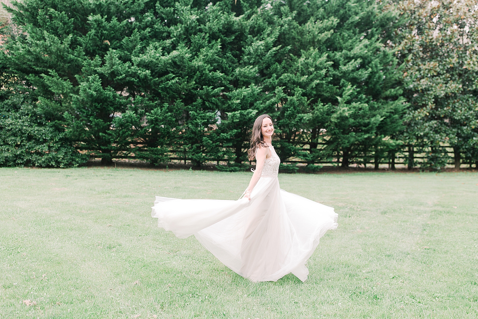 Spring Hawkesdene Wedding Bride twirling in field Photo