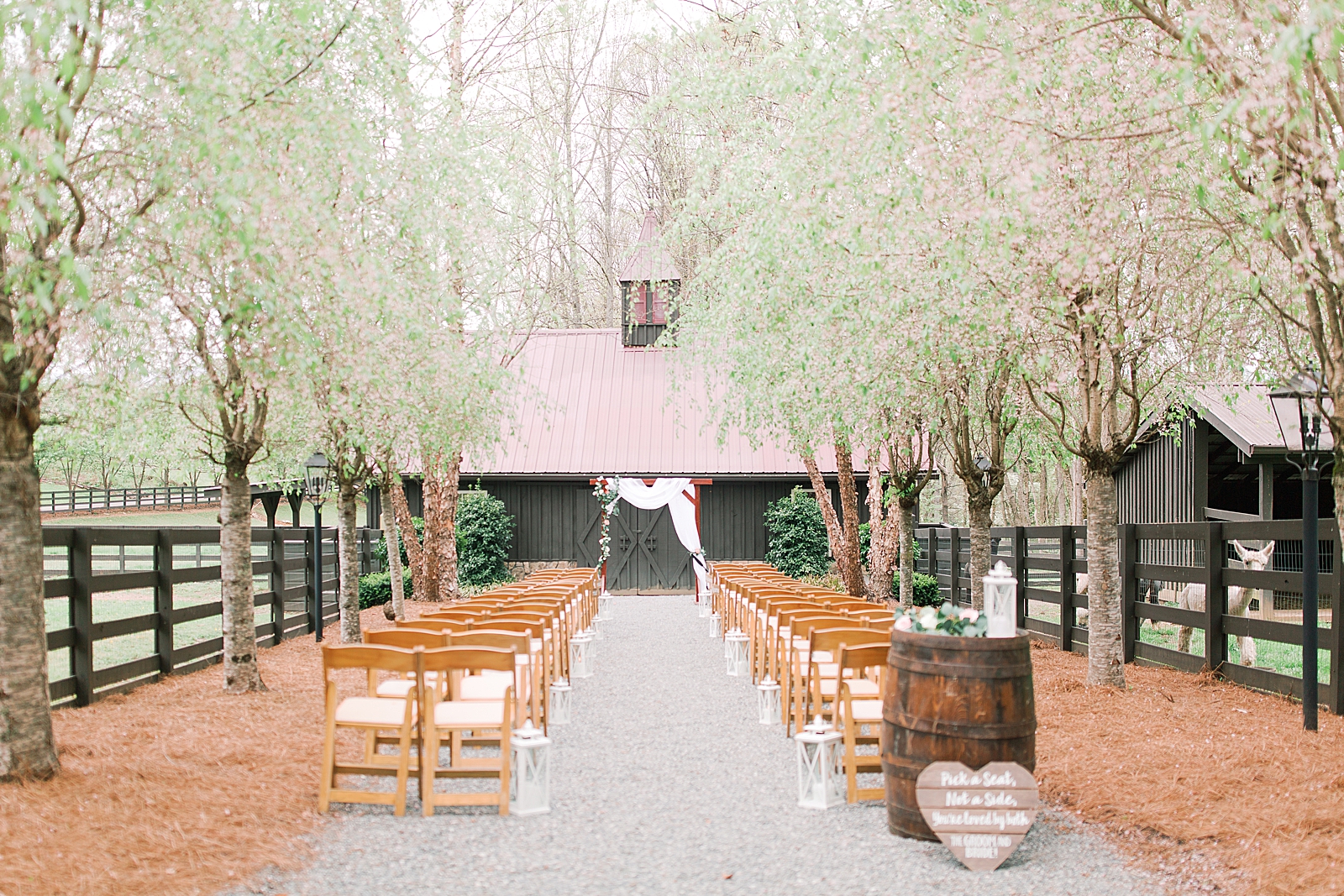 Spring Hawkesdene Wedding Ceremony site at barn under trees Photo