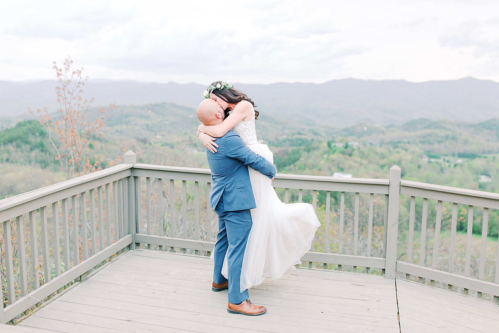 Spring Hawkesdene Wedding Groom holding bride kissing Photo