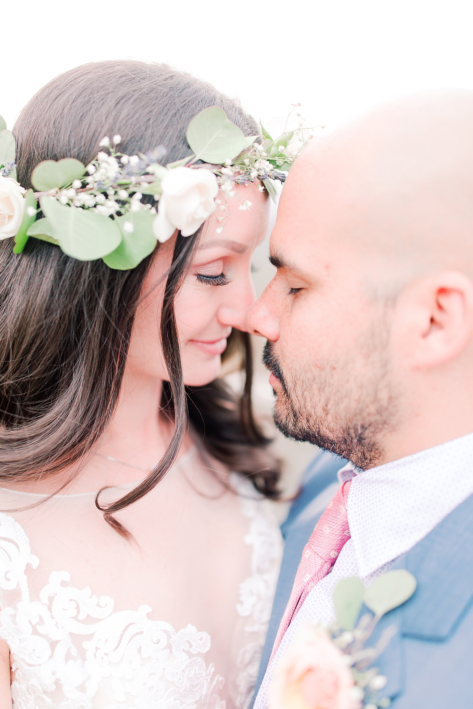 Spring Hawkesdene Wedding Bride wearing flower crown couple nose to nose Photo