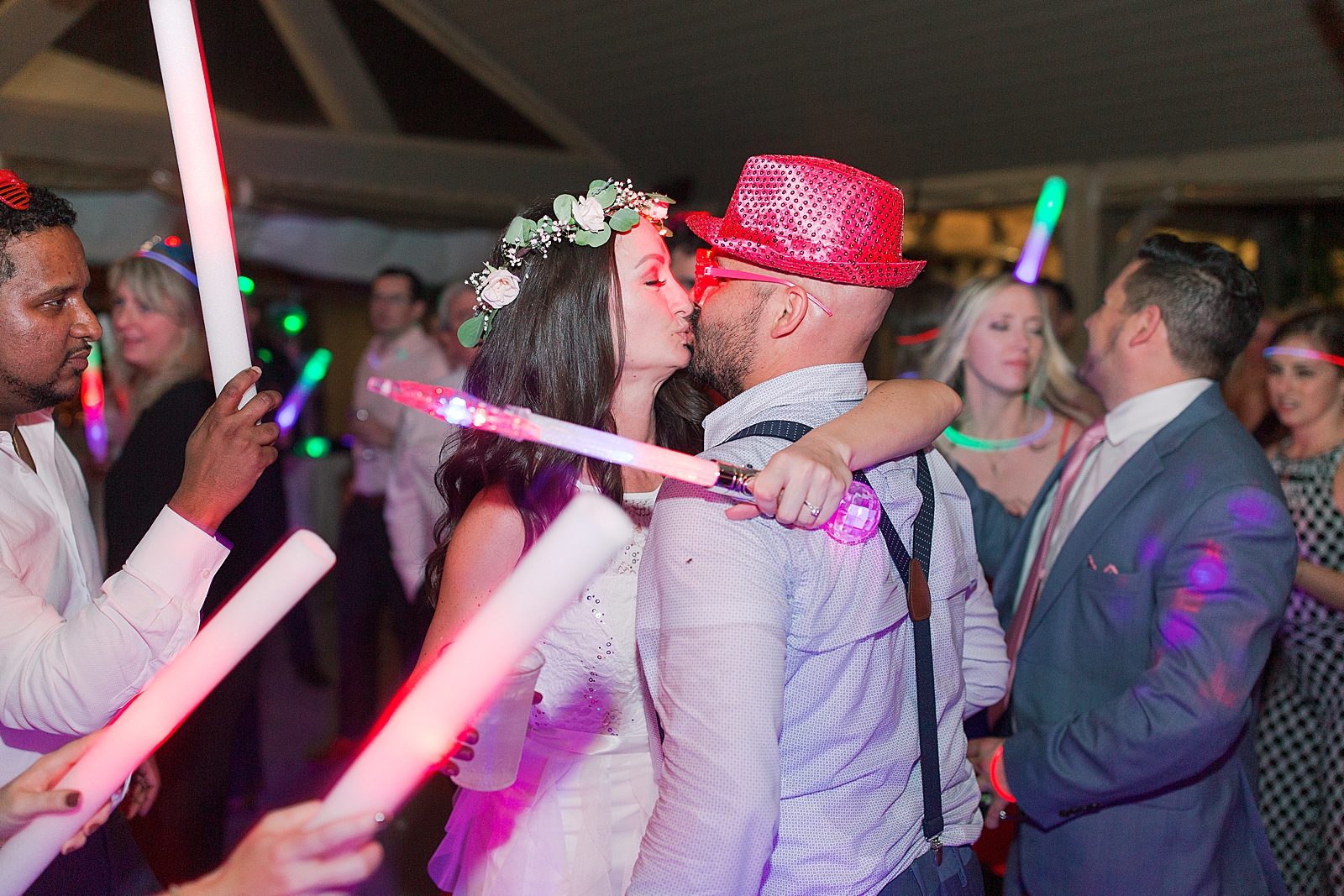 Spring Hawkesdene Wedding Reception Bride and Groom kissing with glow sticks during Crazy Hour Photo