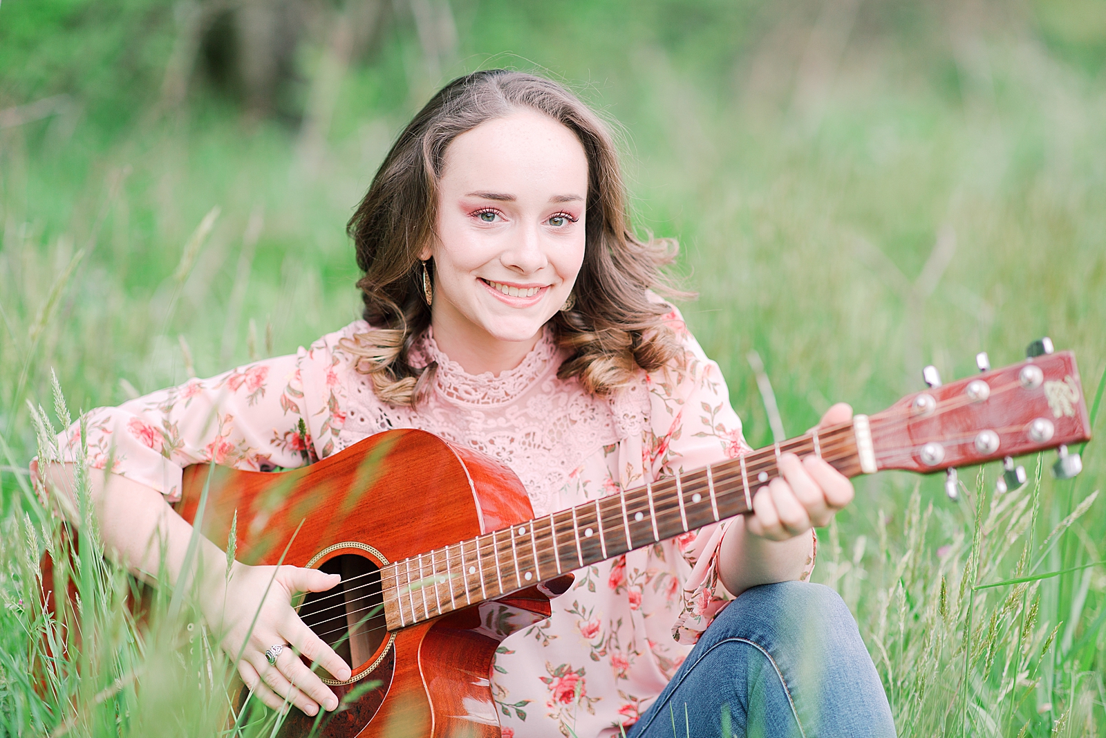 High School Senior Session Zoe smiling at camera playing guitar Photo