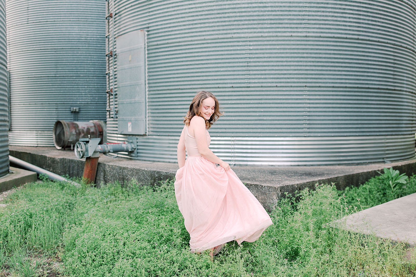 High School Senior Session Zoe twirling in front of silos Photo