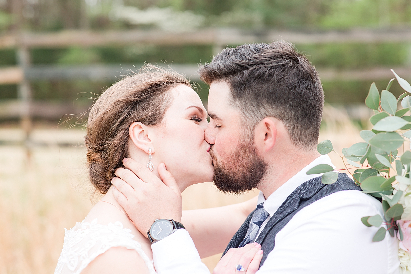 Macedonia Hills Wedding Bride and Groom in Field Kissing Photo