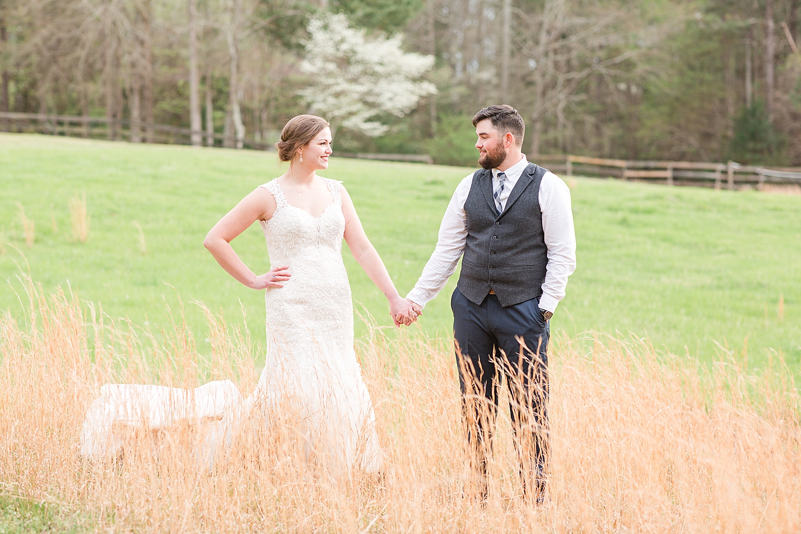 Macedonia Hills Wedding bride and groom holding hands in field photo