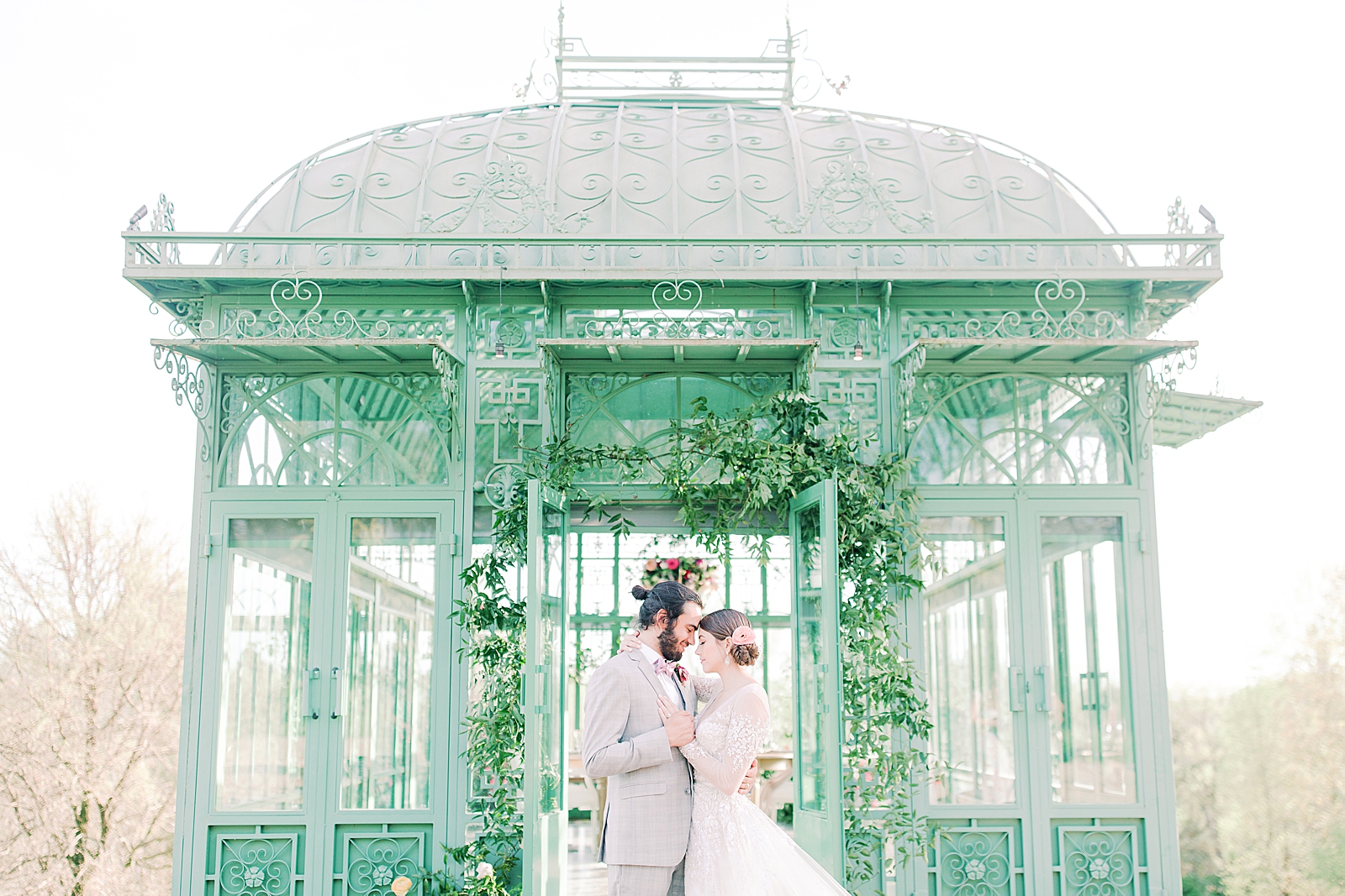 2400 On The River Wedding Bride and Groom forehead to forehead in front of Greenhouse Photo