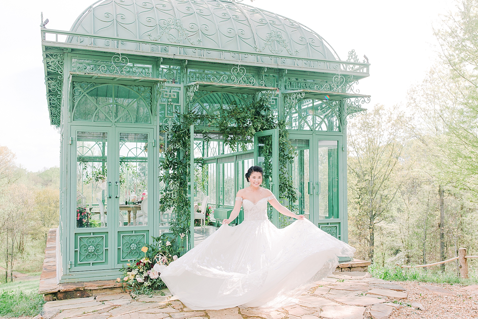 2400 On The River Bridal Session Lily twirling in front of Greenhouse Photo