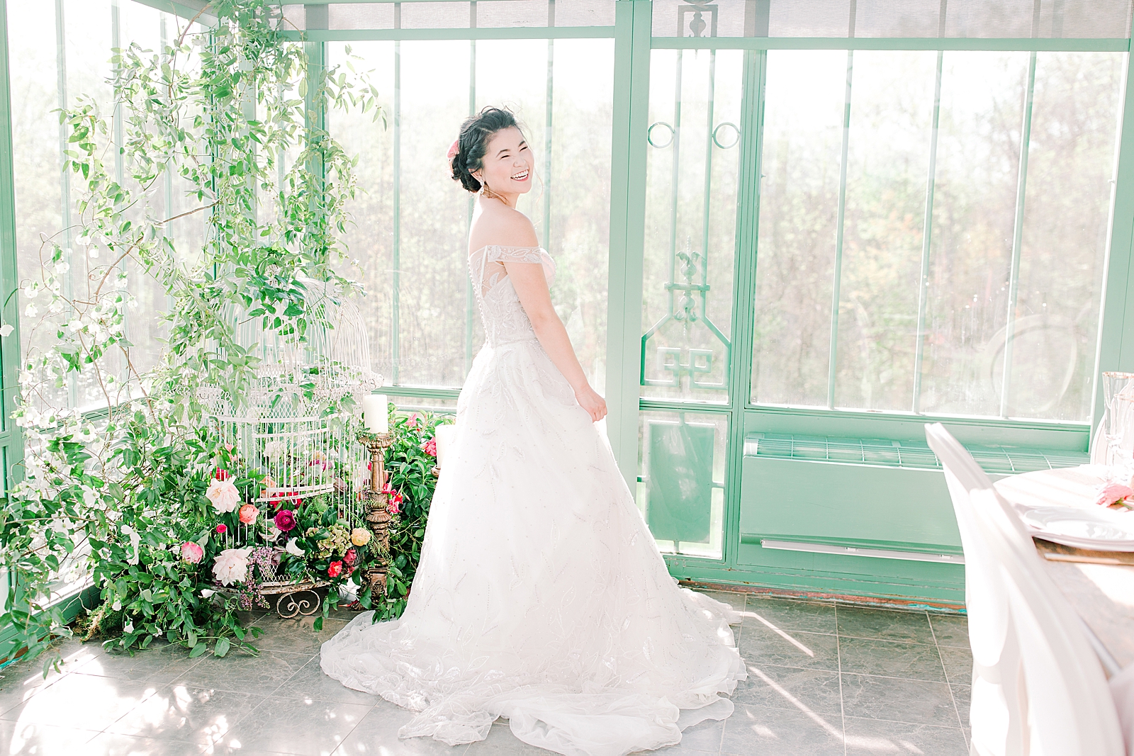 2400 On The River Bridal Session Lily smiling in the Greenhouse Photo