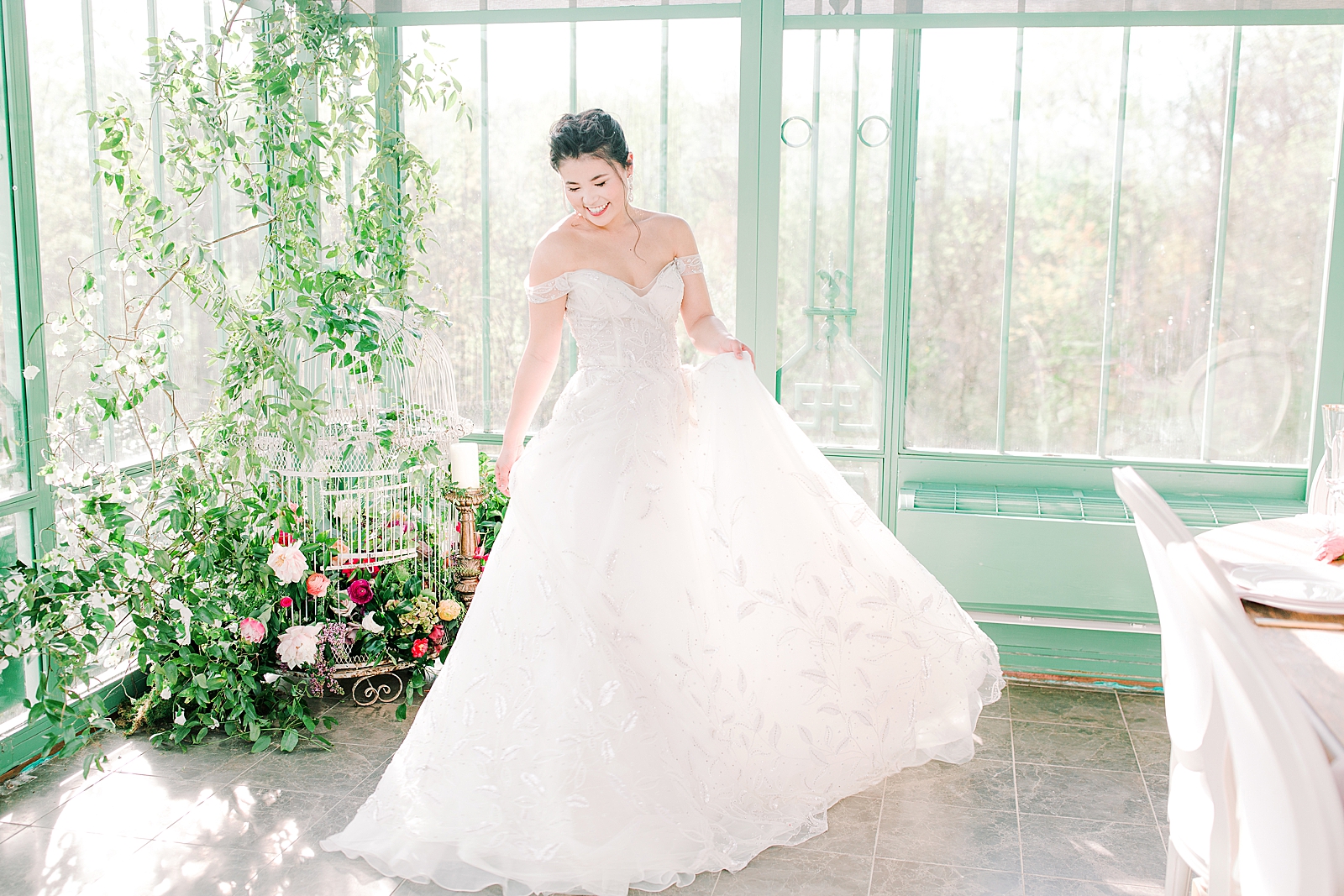 2400 On The River Bridal Session Lily twirling in Greenhouse Photo