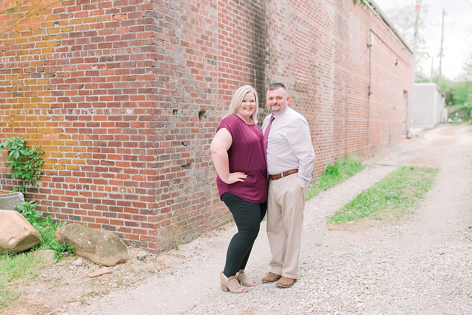 Asheville Anniversary Session couple smiling in alley way Photo