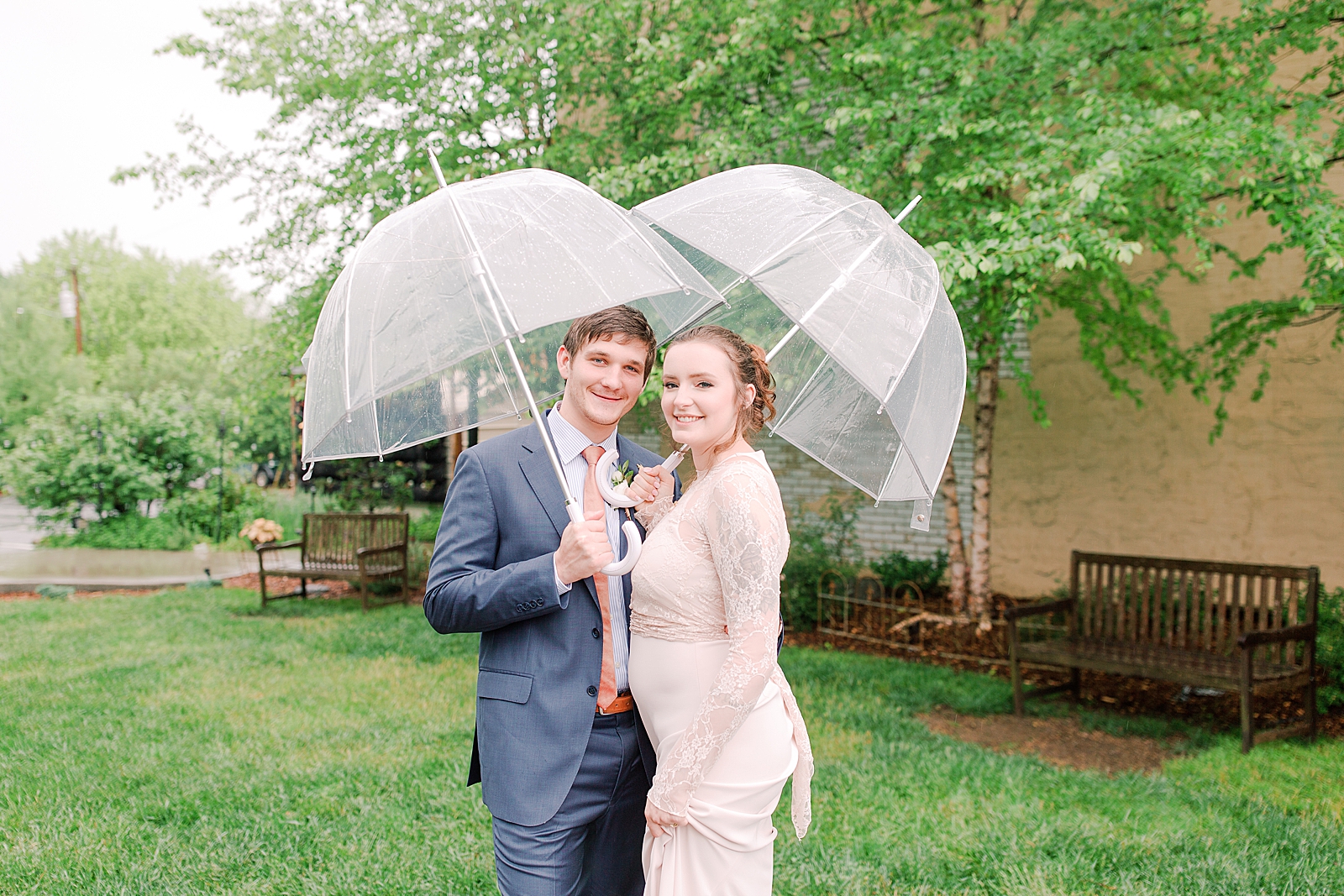 Asheville Wedding Bride and Groom smiling under umbrellas Photo