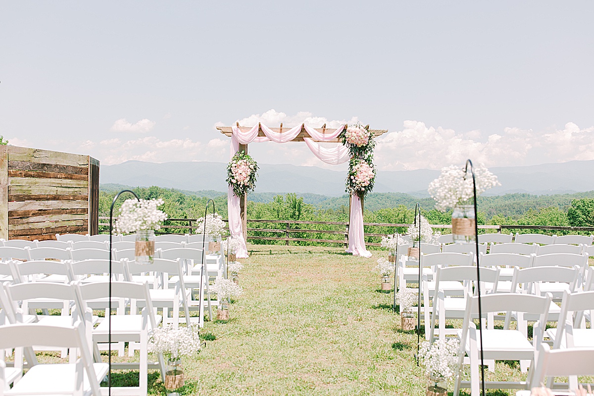Rustic Spring Mountain Wedding Ceremony Site Alter with Pink Sashes and Roses Photo