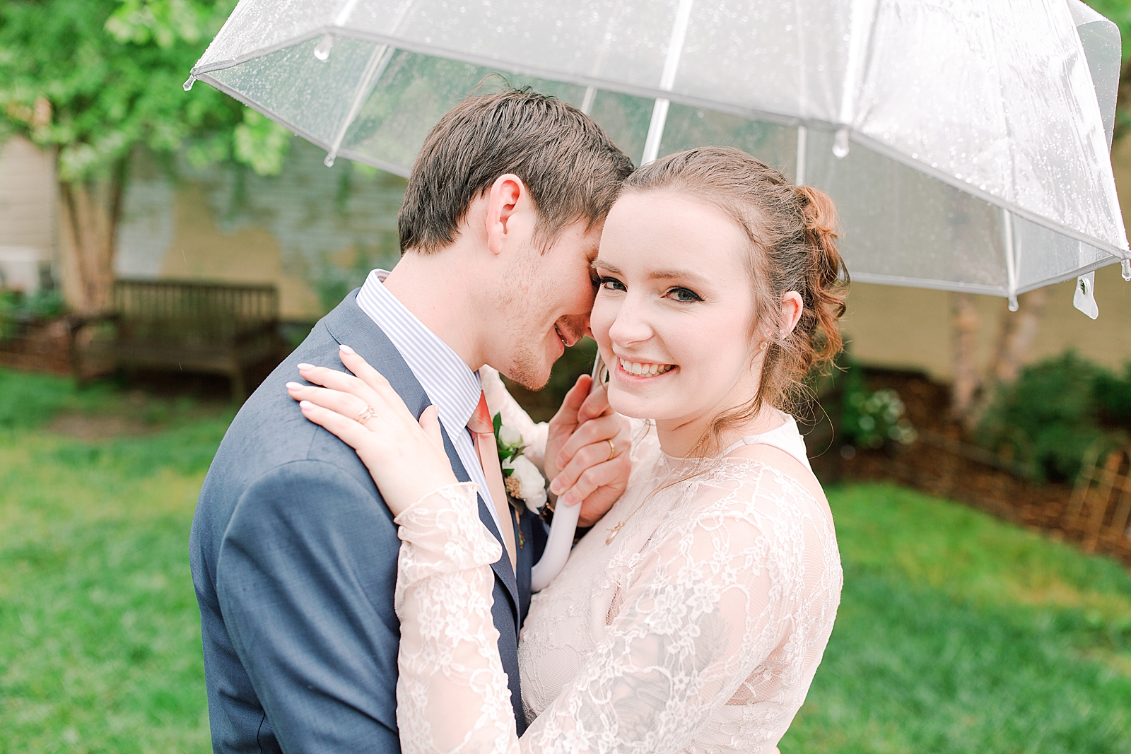 Asheville Wedding Bride and Groom snuggling under umbrella Photo