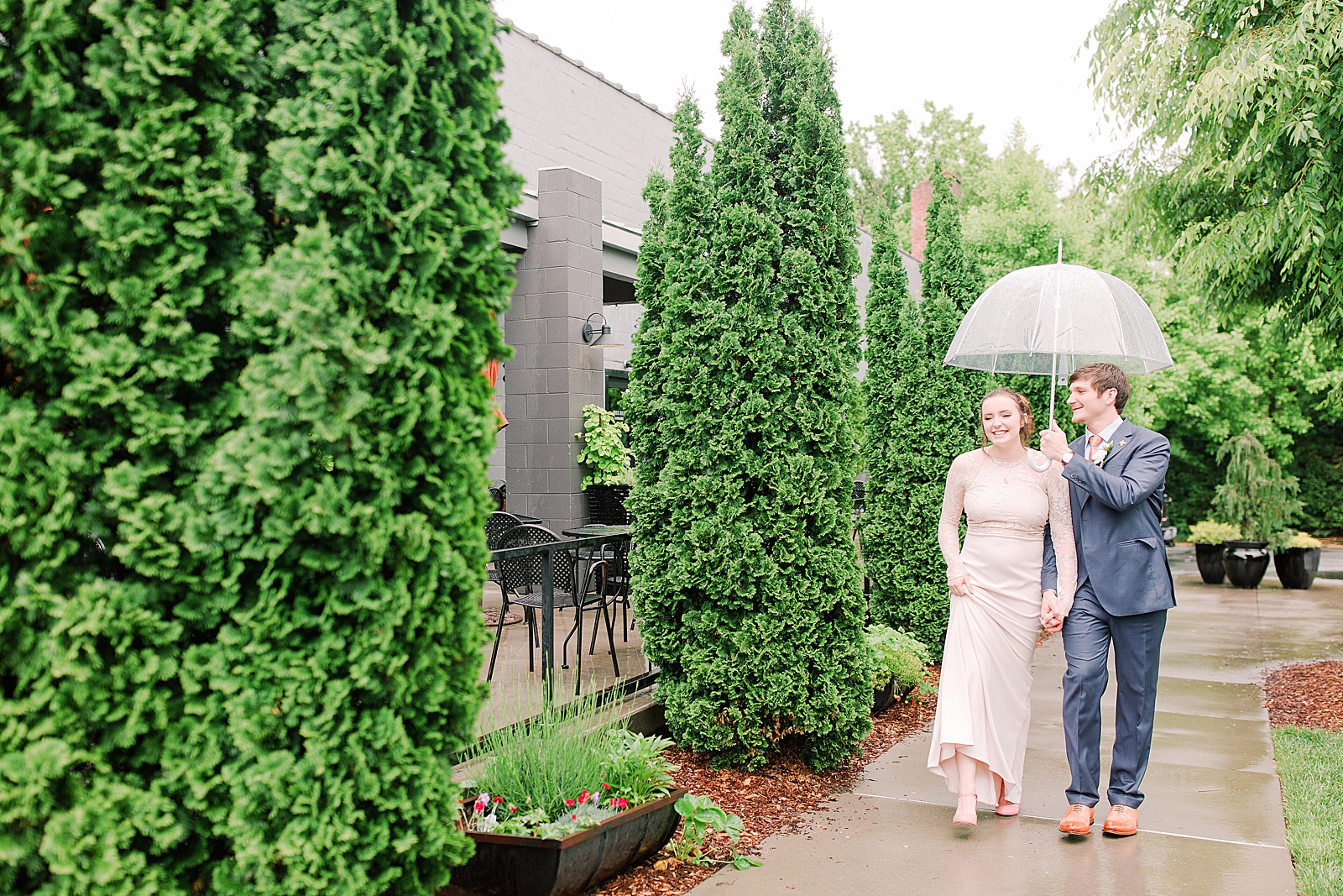 Asheville Wedding Bride and Groom walking under Umbrella Photo
