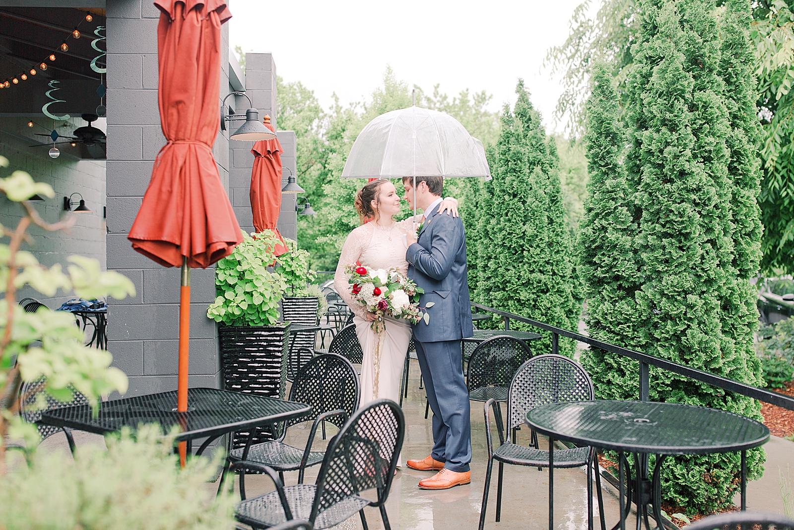 Asheville Wedding Bride and Groom on Patio under umbrella Photo