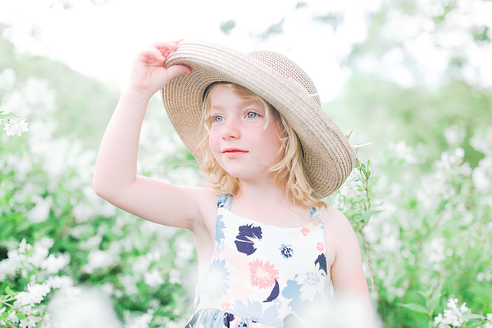 Biltmore House and Gardens little girl hold her hat in white flowers Photo