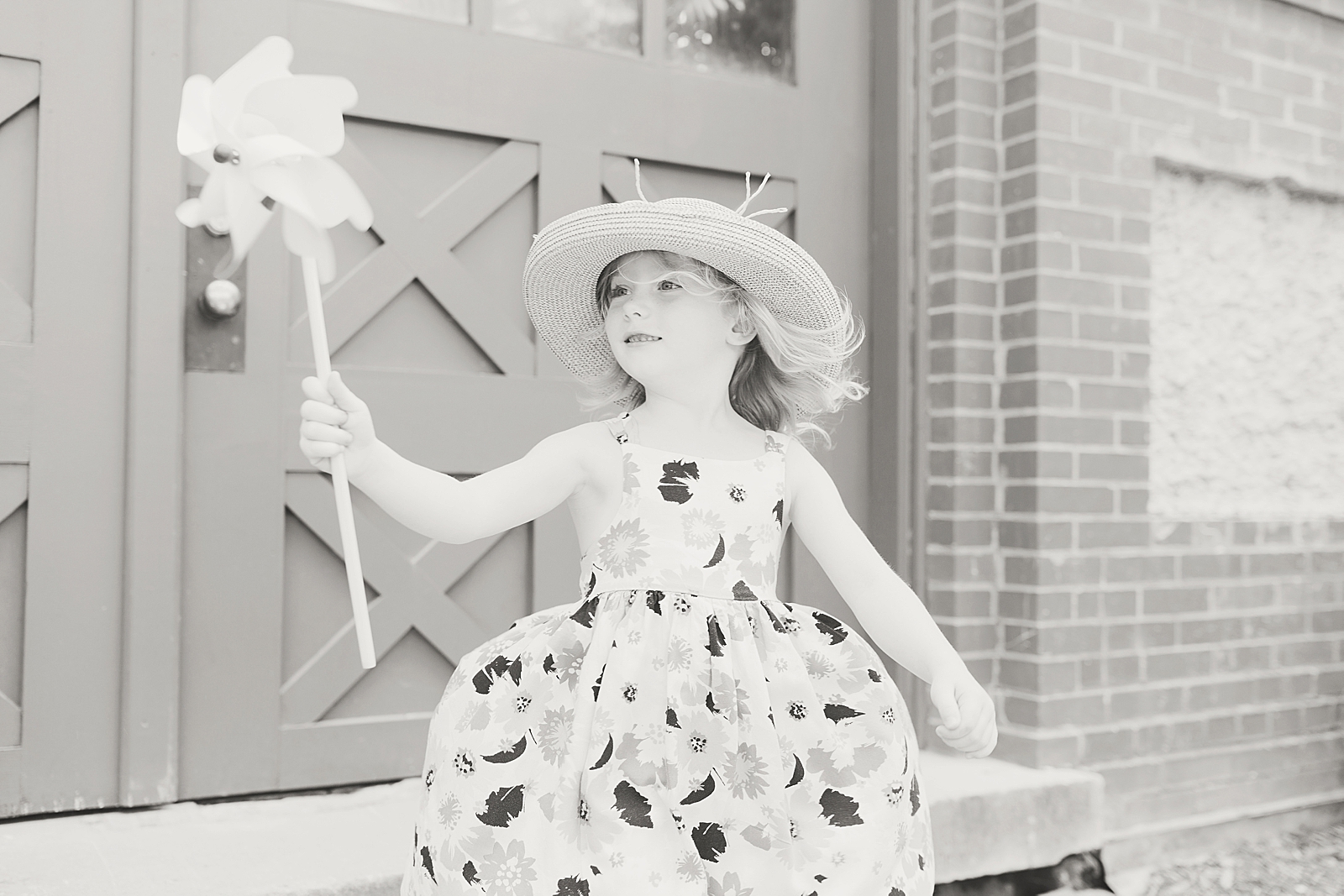 Biltmore House and Gardens black and white of little girl with pinwheel blowing in the wind Photo