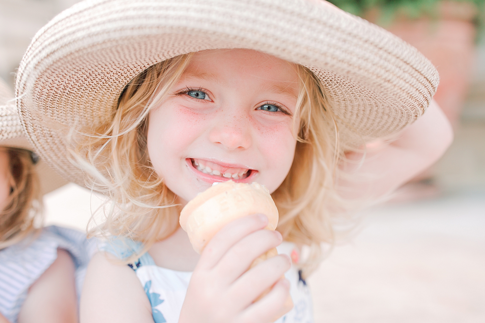 Biltmore House and Gardens little girl smiling holding hat eating ice cream Photo