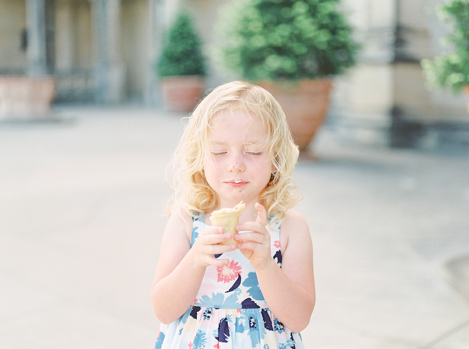 Biltmore House and Gardens little girl eating ice cream in front of house Photo