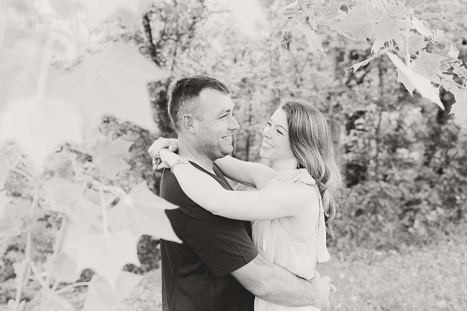 Hackney Warehouse Engagement Session Black and white of couple hugging and smiling Photo