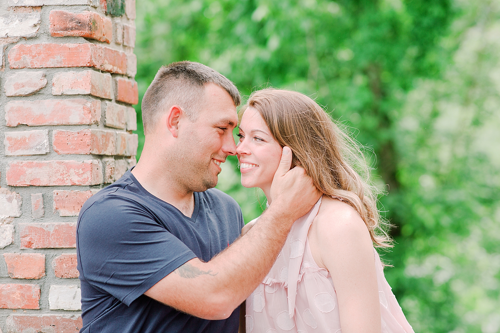 Hackney Warehouse Engagement Session Couple snuggling nose to nose Photo