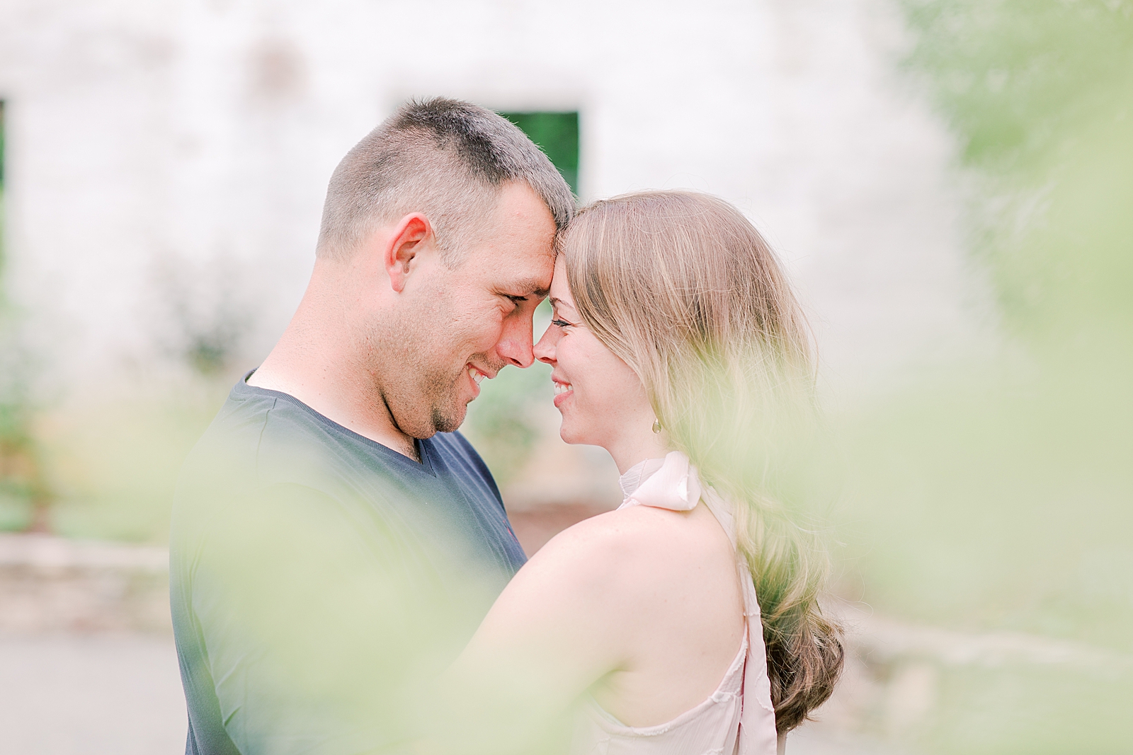 Hackney Warehouse Engagement Session Couple nose to nose smiling Photo