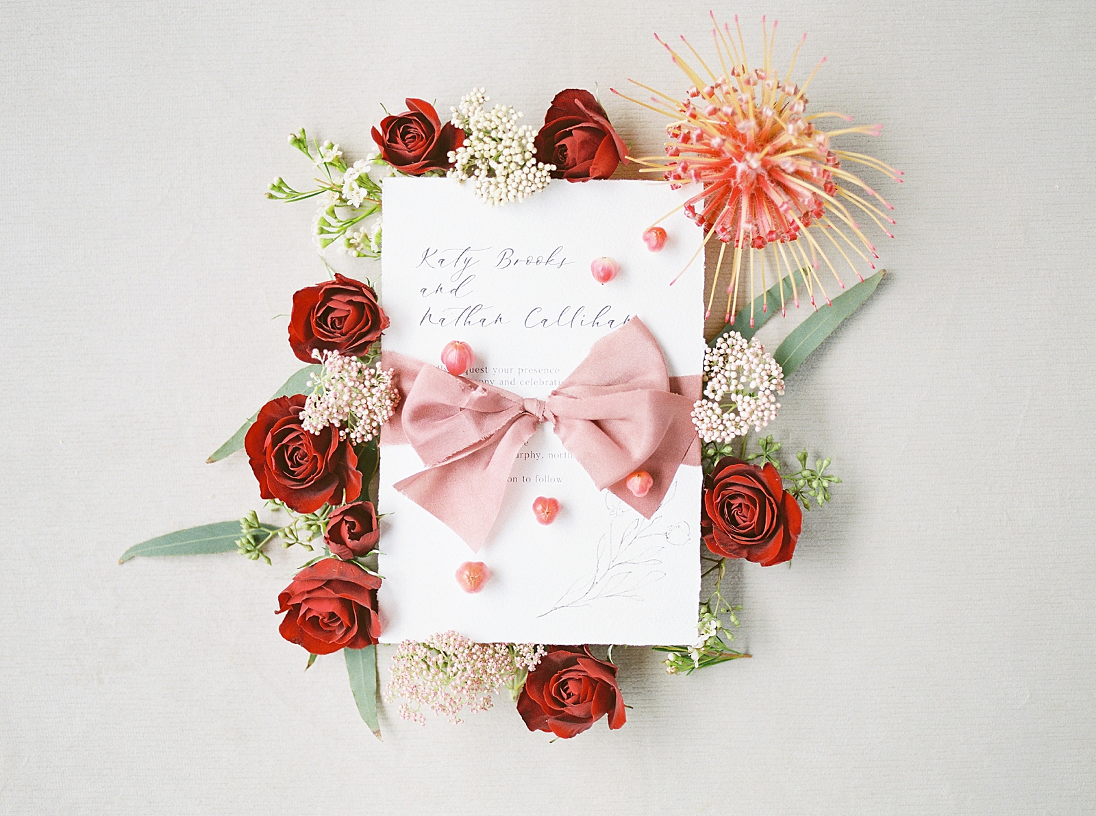 Hackney Warehouse Wedding Invitation Suite surrounded by flowers Photo