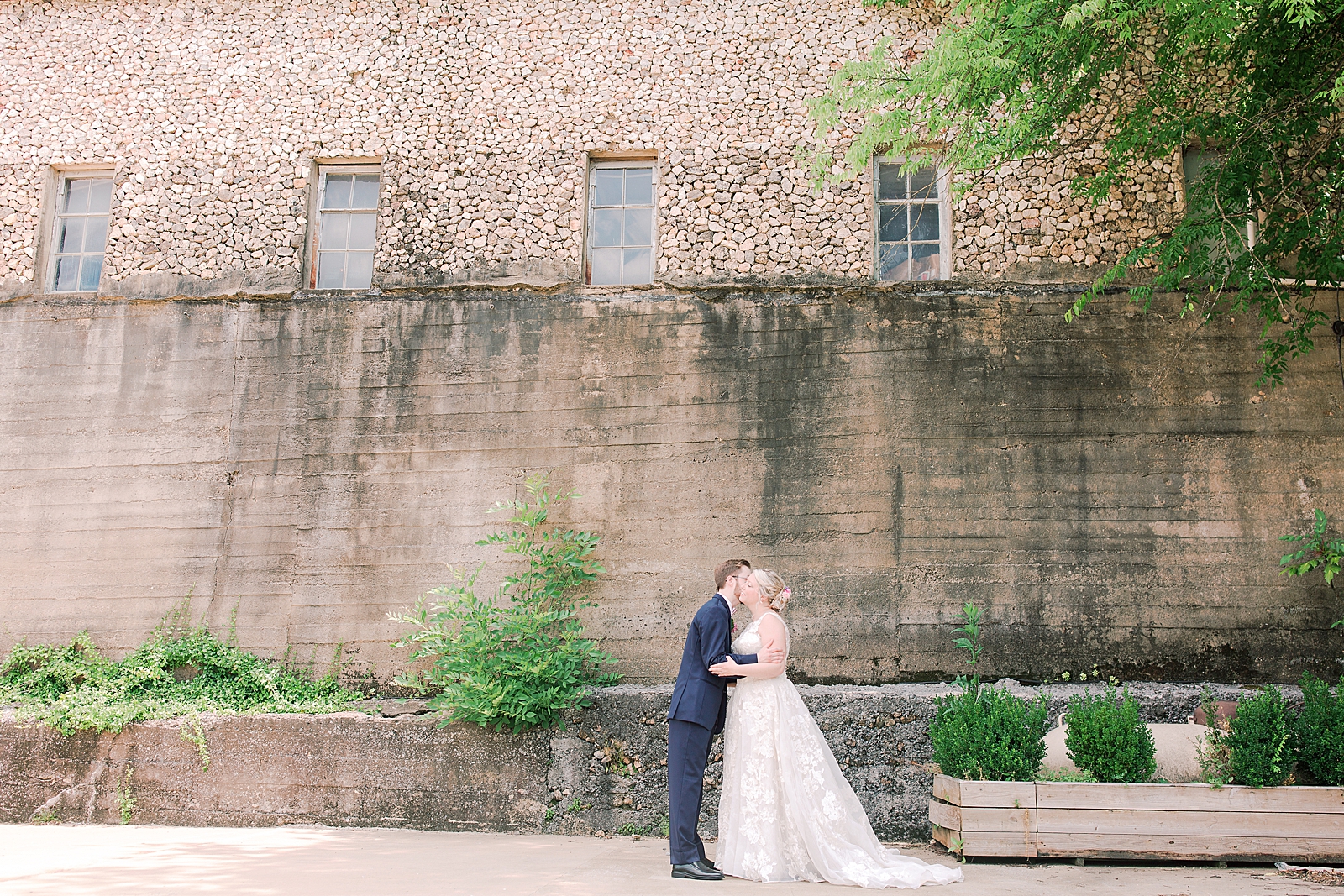 Black Fox Farms Garden Wedding Bride and Groom First look in front of old building Photo