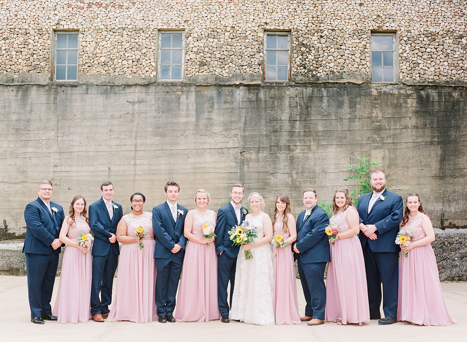 Black Fox Farms Garden Wedding Bride and Groom with Bridal Party in Front of Old Building Photo