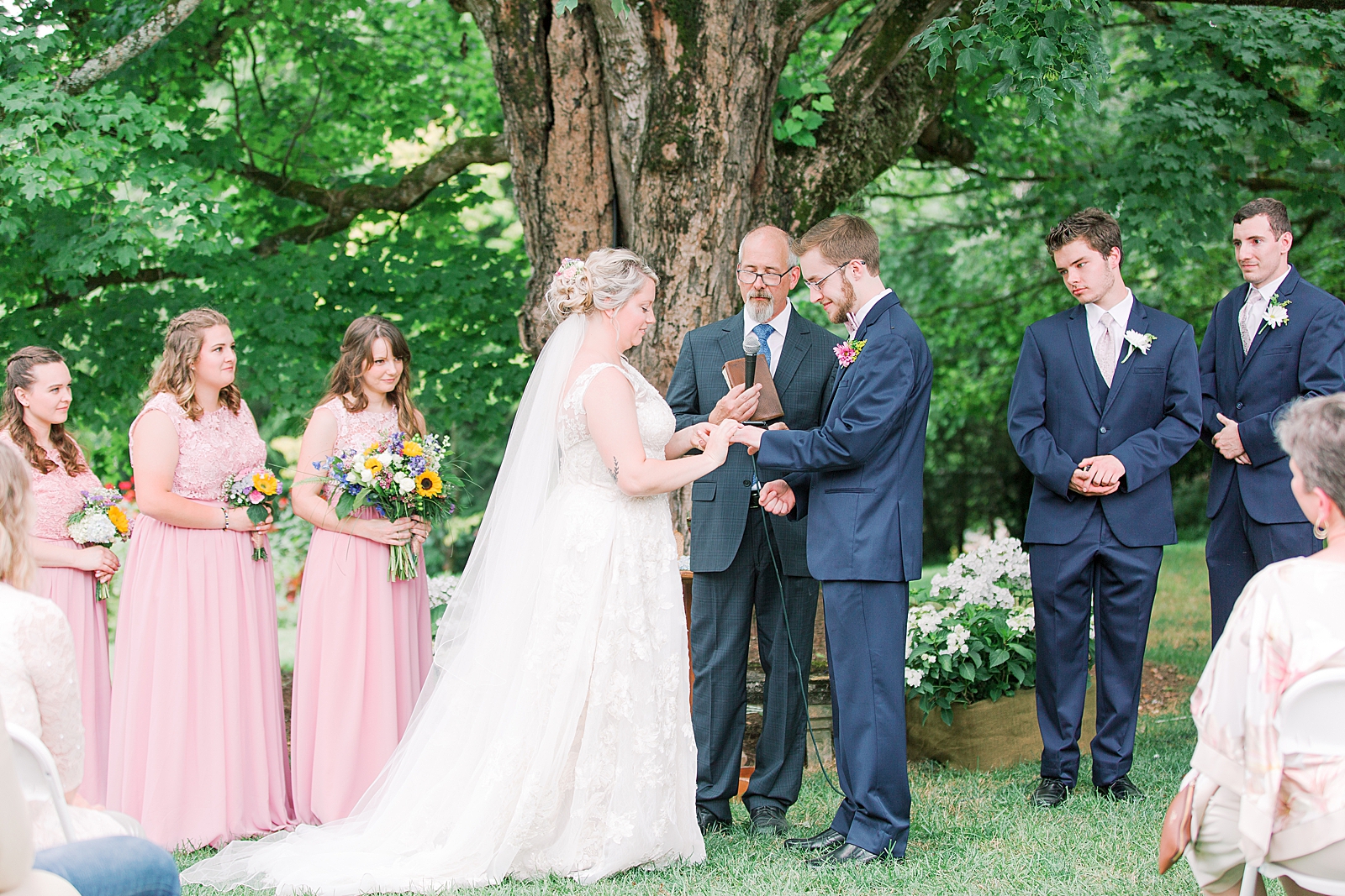 Black Fox Farms Garden Wedding Ceremony Bride and Groom Exchanging Rings Photo