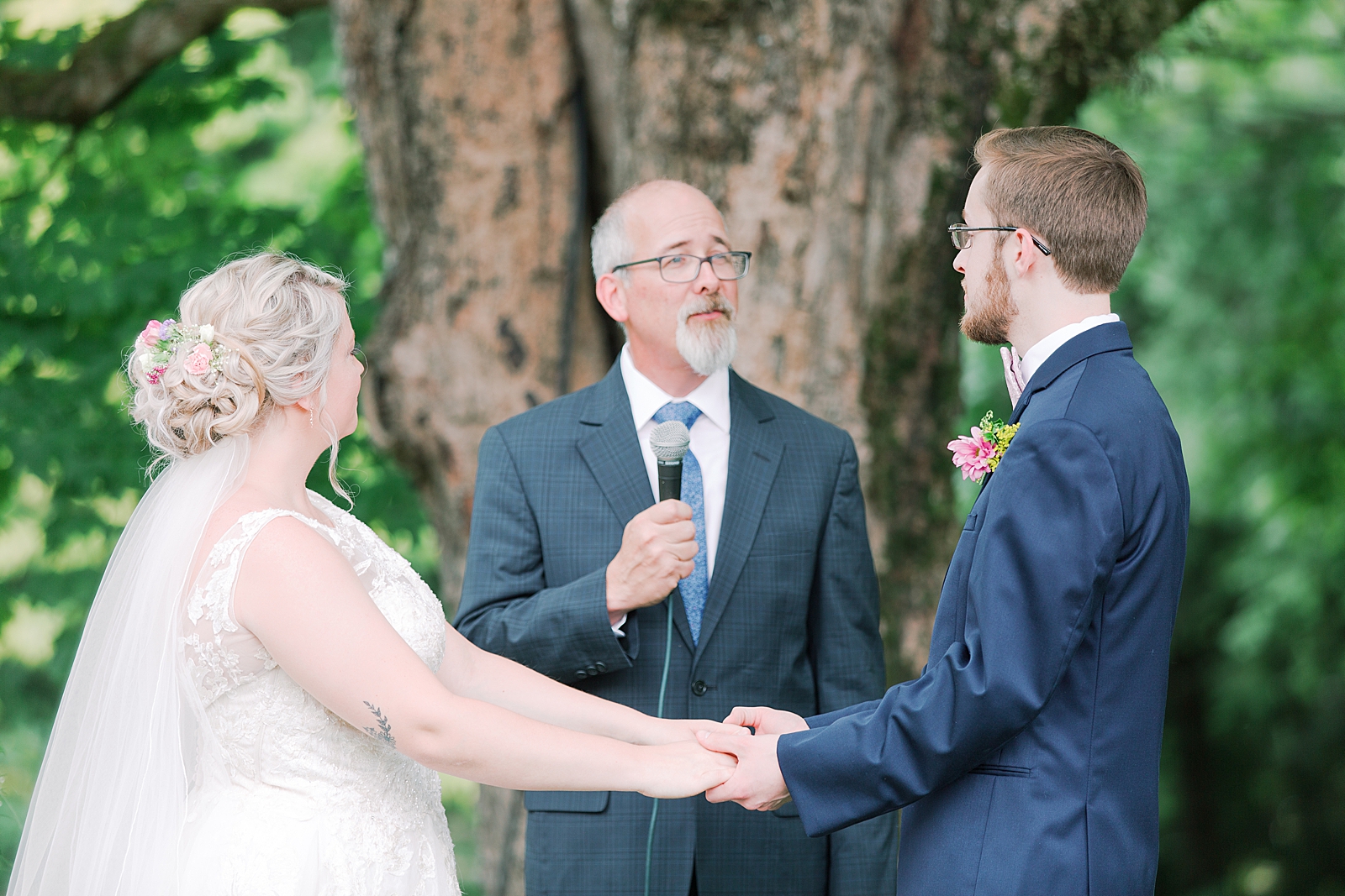Black Fox Farms Garden Wedding Ceremony Couple holding hands and sharing vows Photo